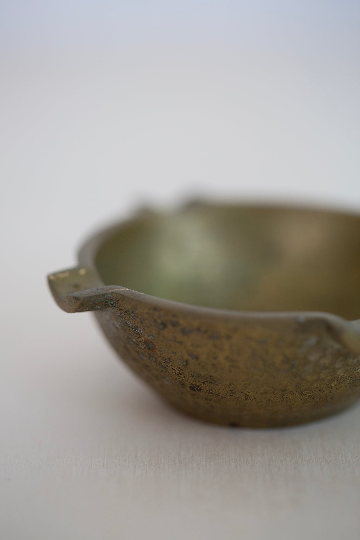 Cast brass ashtray with hammered texture