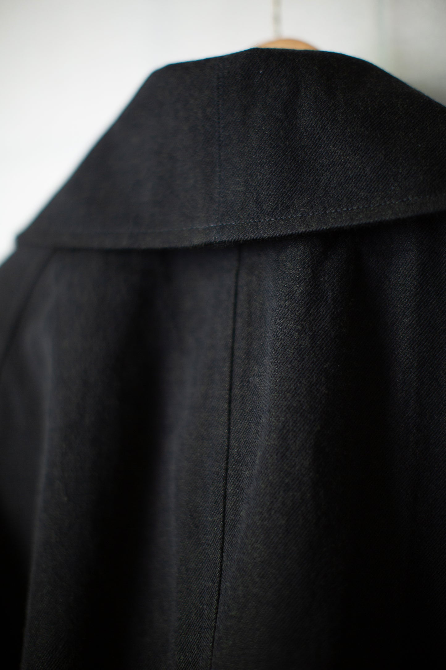 Overcoat in black/green wool-cotton twill