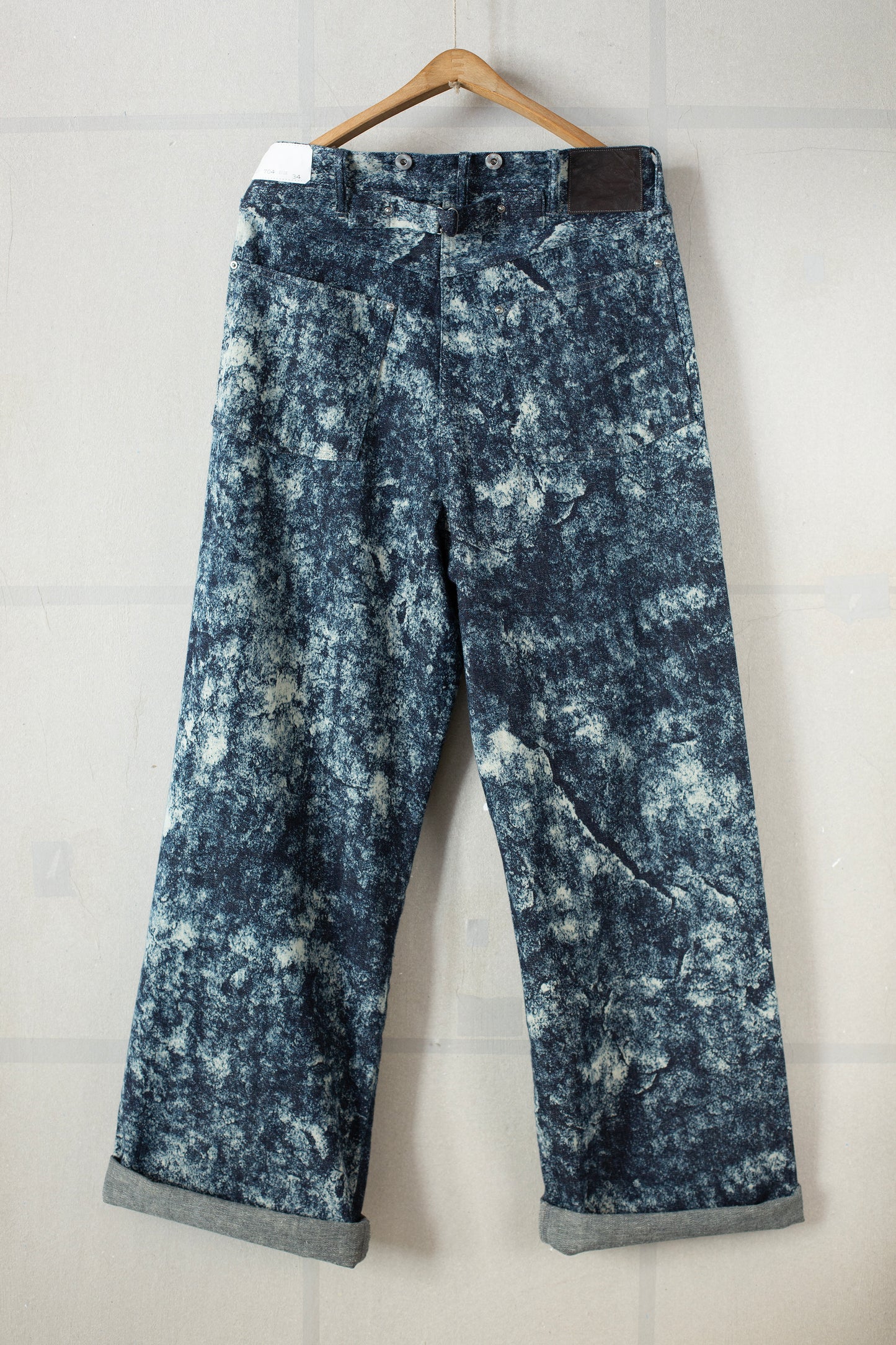 Discharged indigo denim trousers