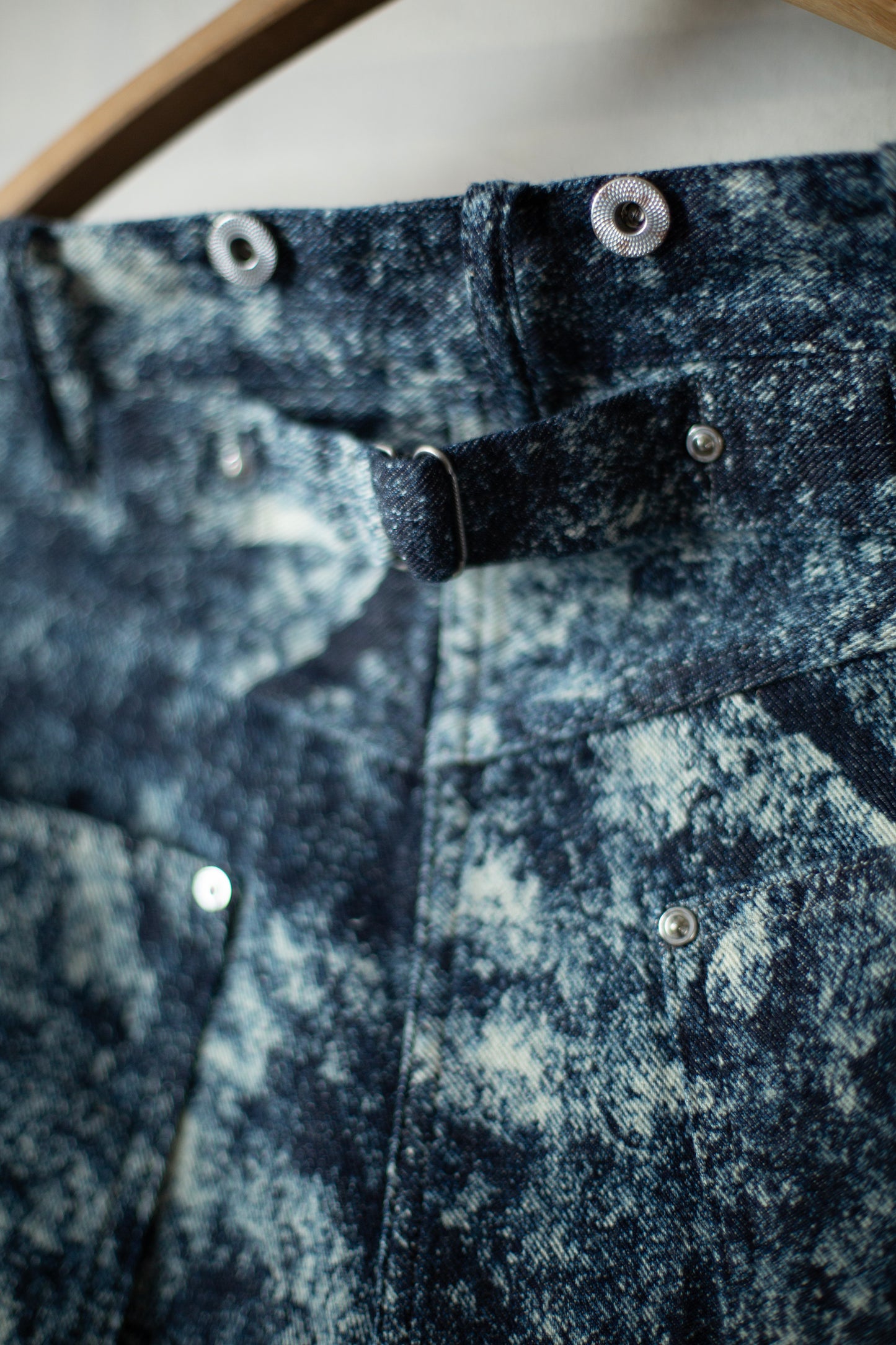 Discharged indigo denim trousers