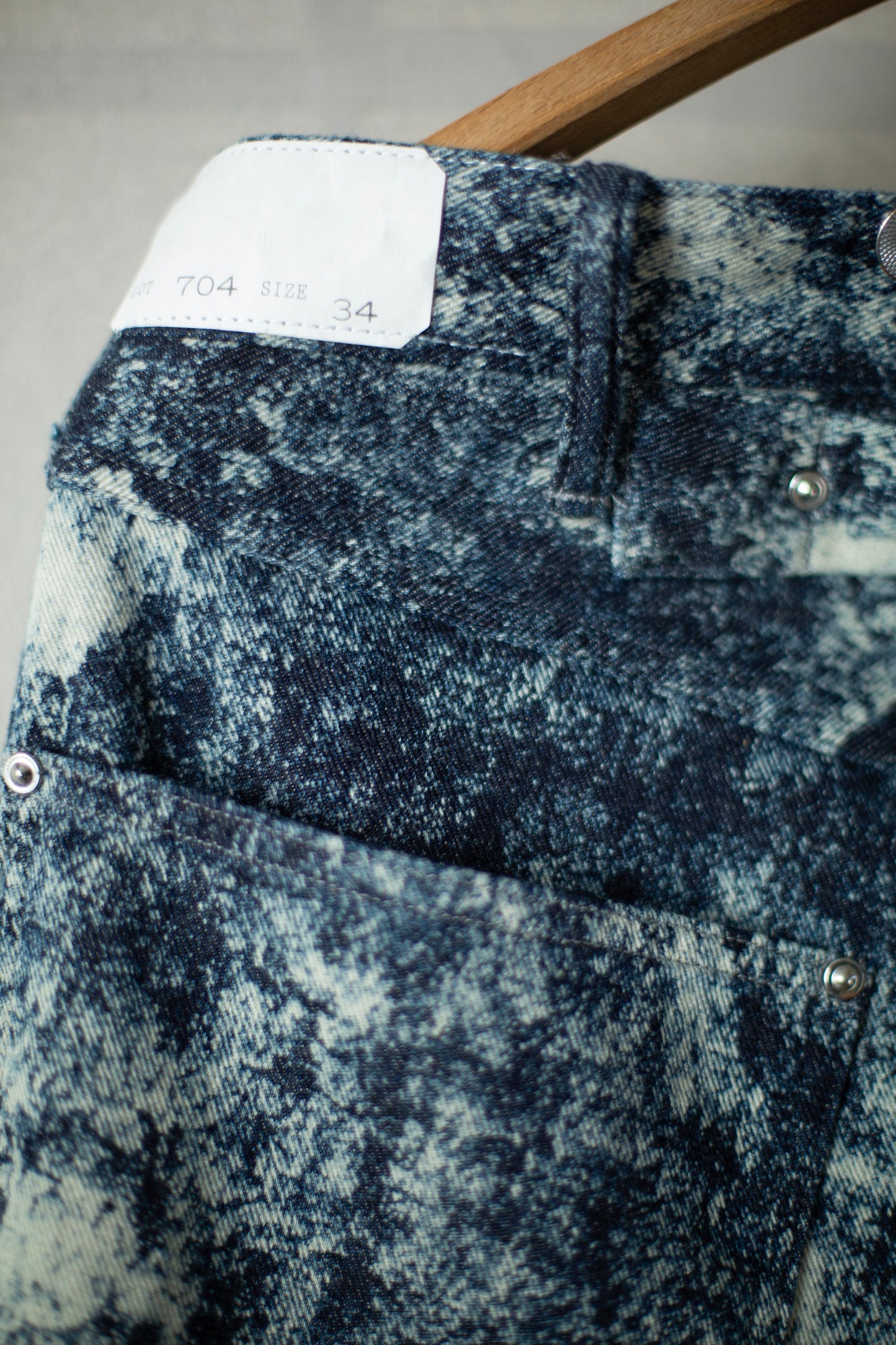 Discharged indigo denim trousers