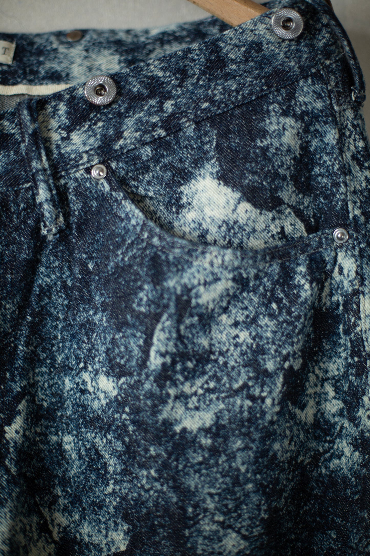 Discharged indigo denim trousers