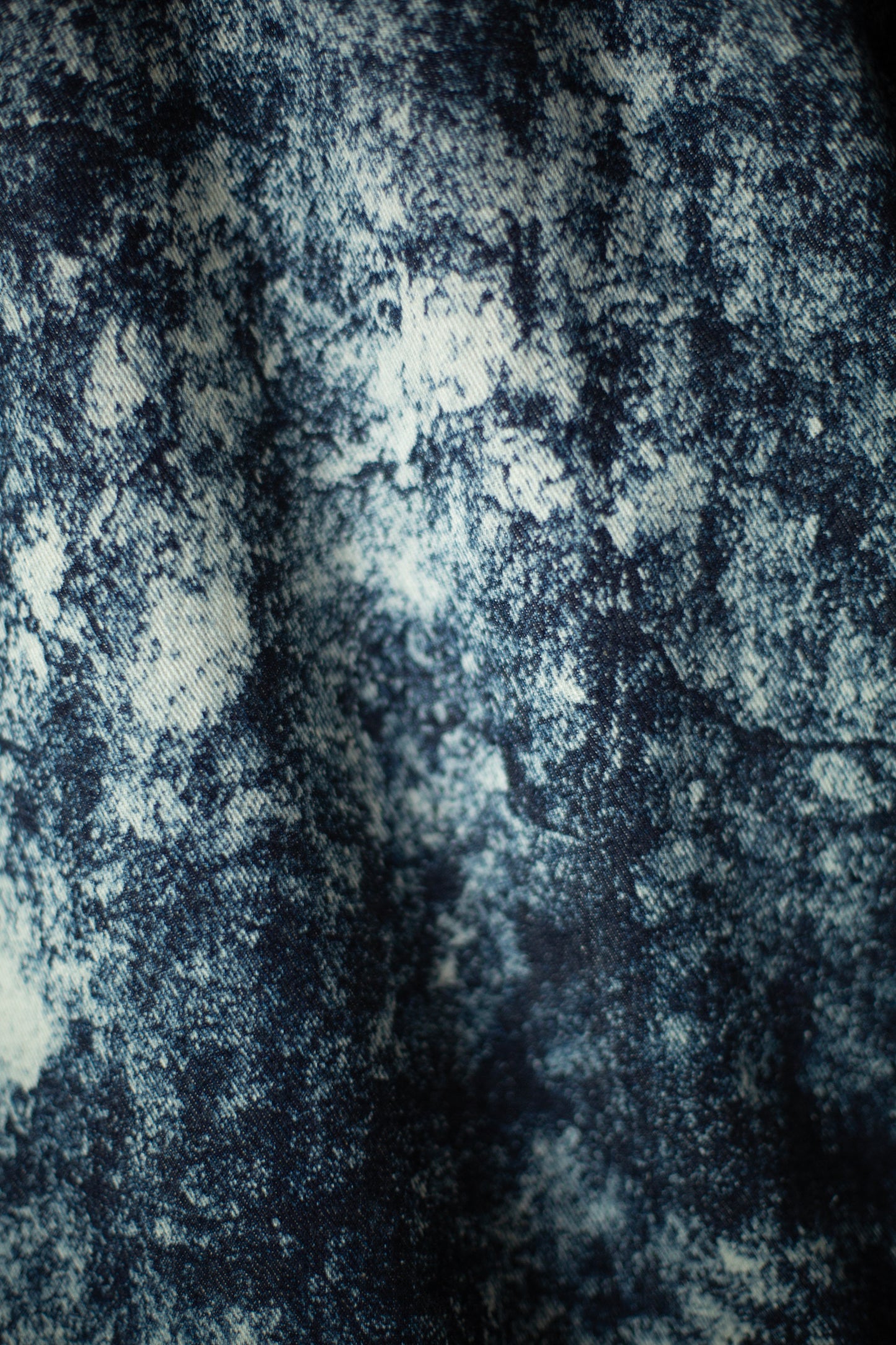 Discharged indigo denim trousers