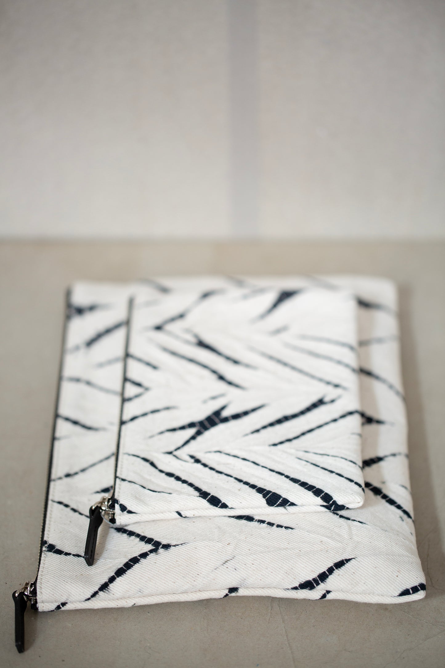 black / ivory organic cotton pouch M with shibori dyed pattern