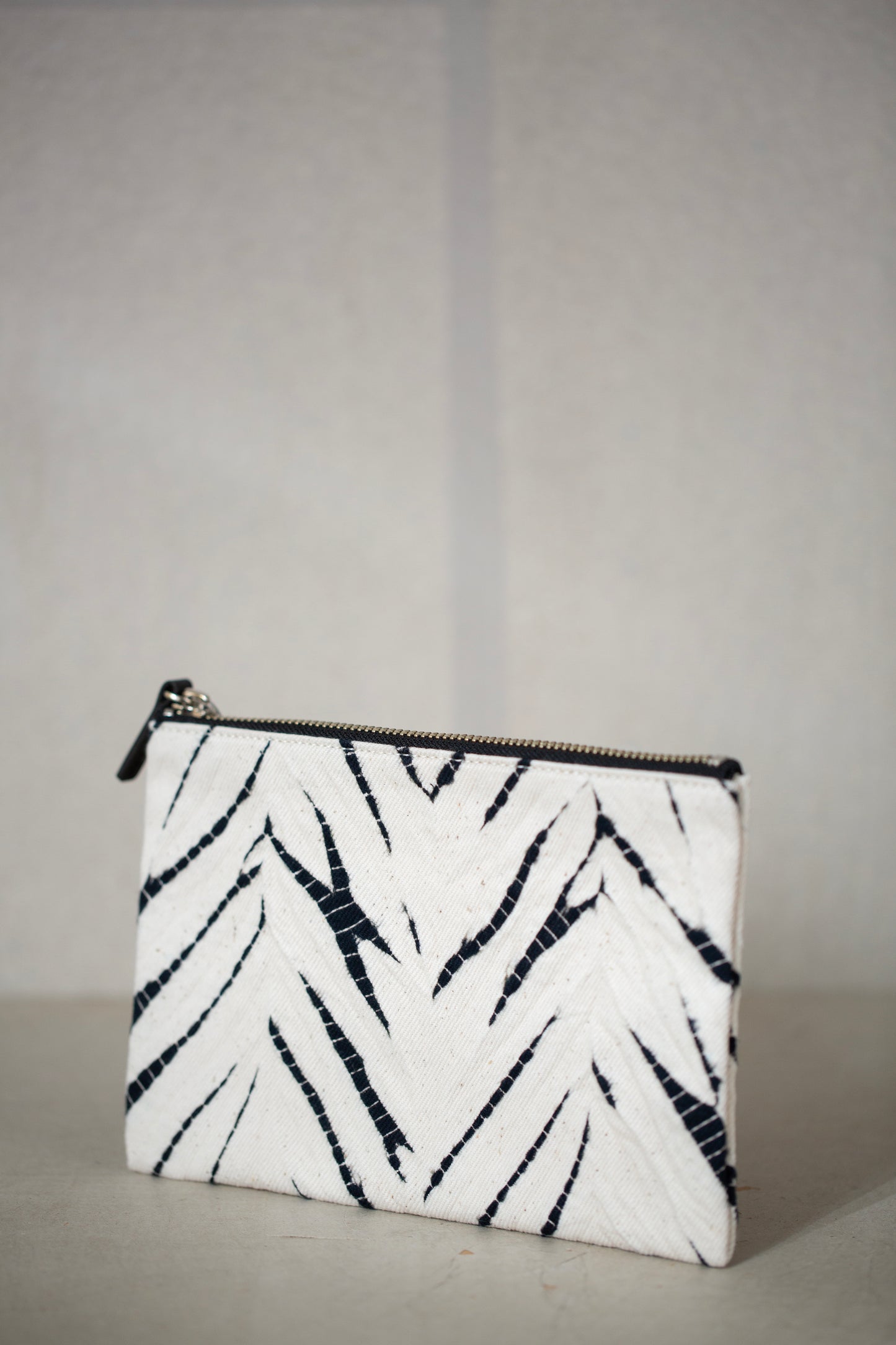 black / ivory organic cotton pouch S with shibori dyed pattern