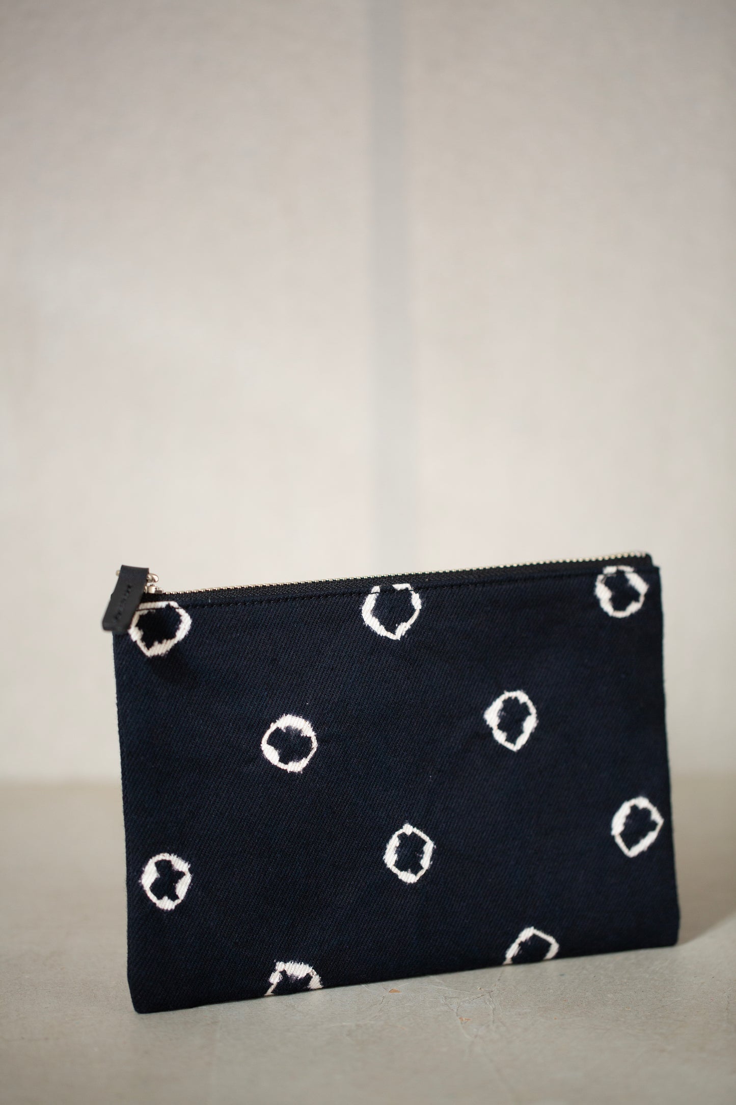 black / ivory organic cotton pouch S with shibori dyed pattern