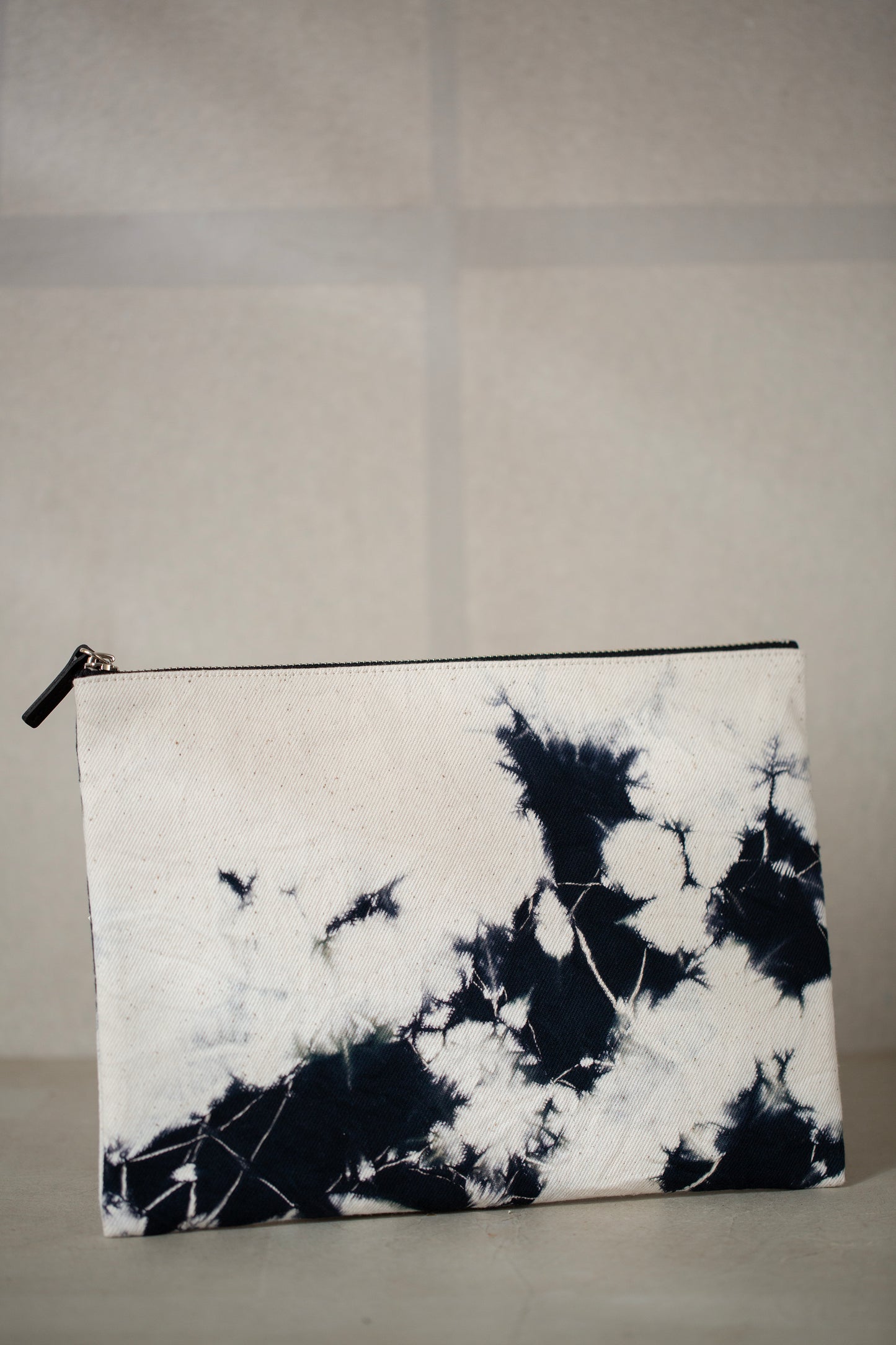 black / ivory organic cotton pouch M with shibori dyed pattern