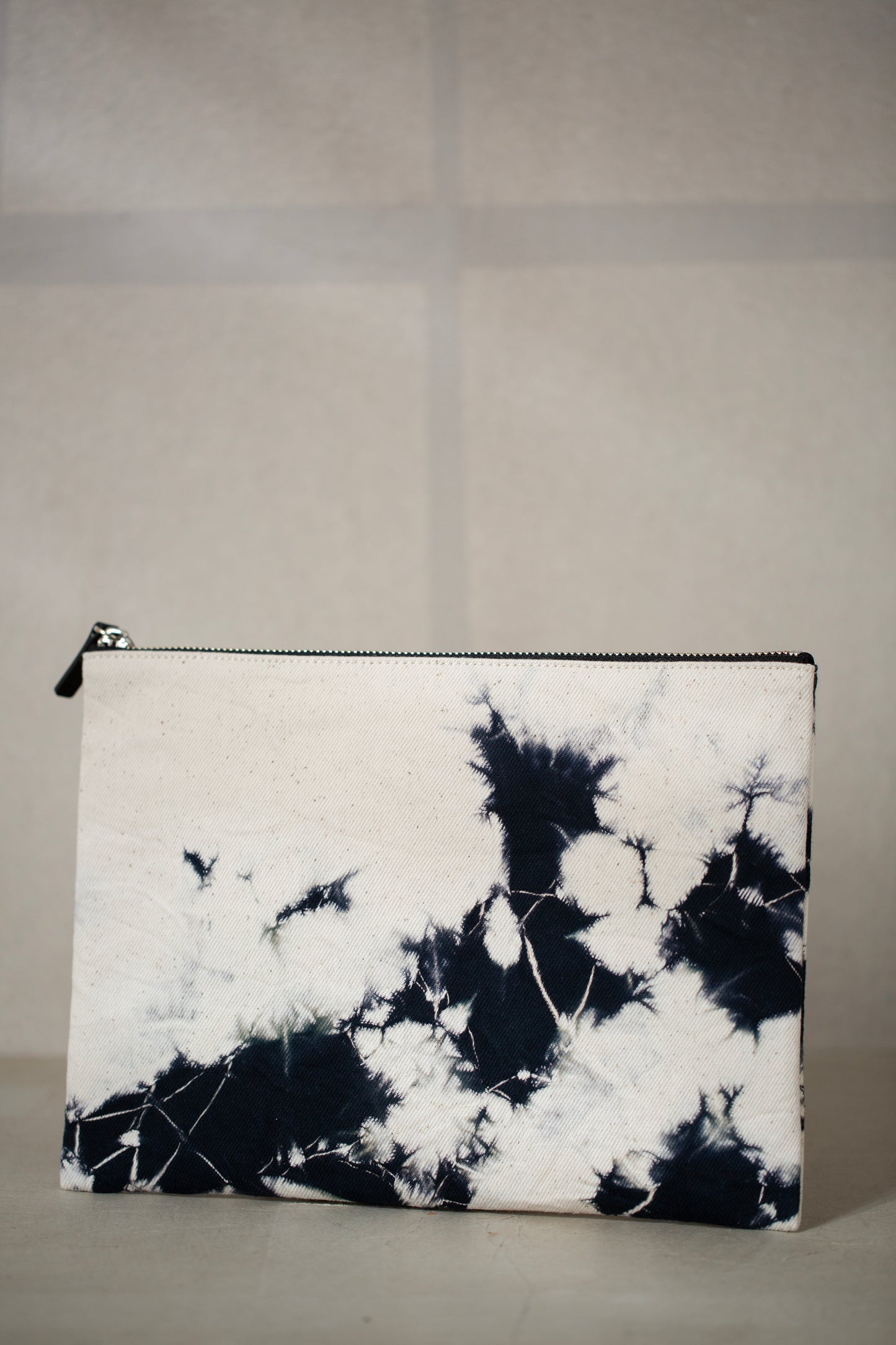 black / ivory organic cotton pouch M with shibori dyed pattern