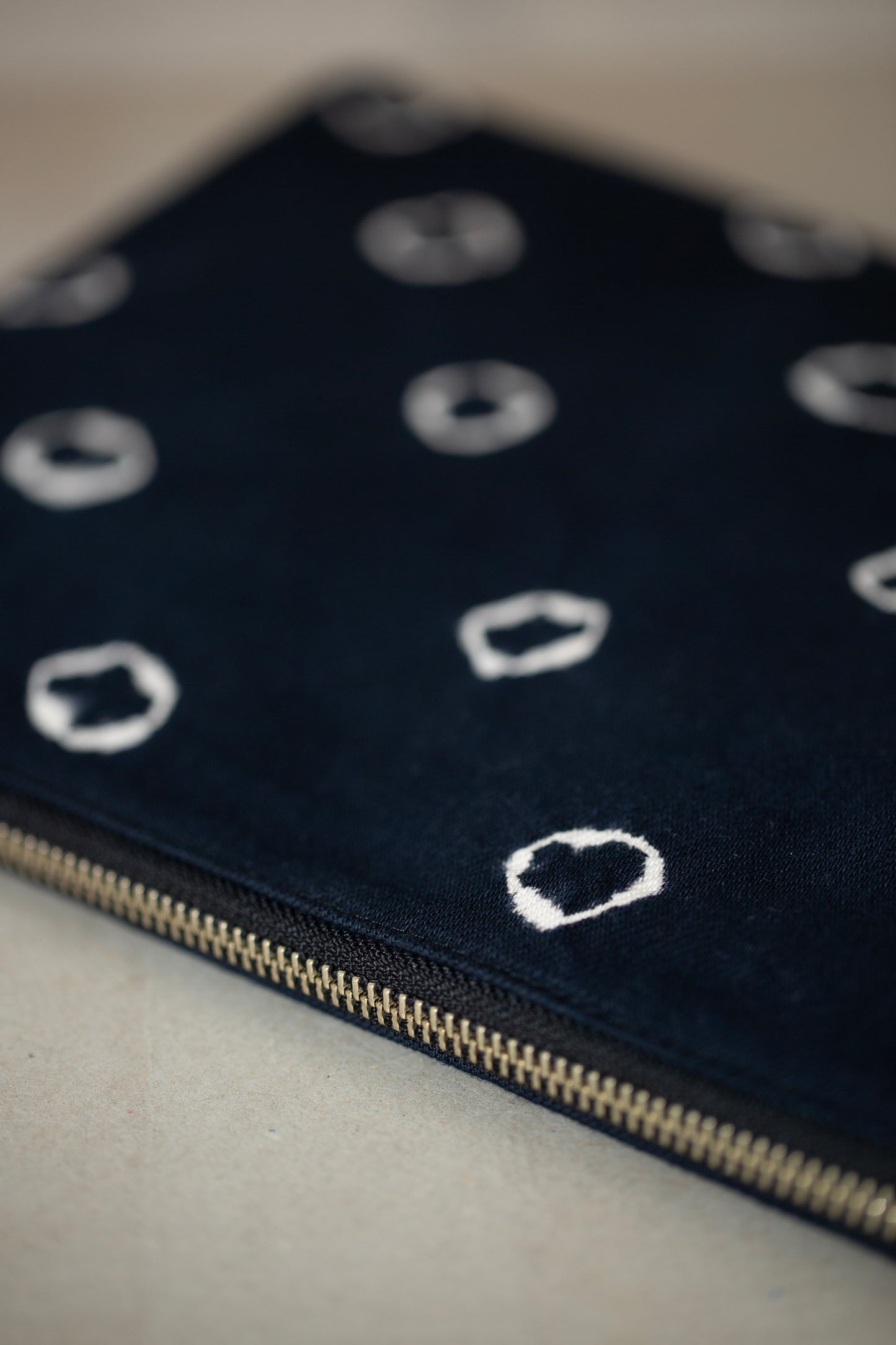 black / ivory organic cotton pouch M with shibori dyed pattern