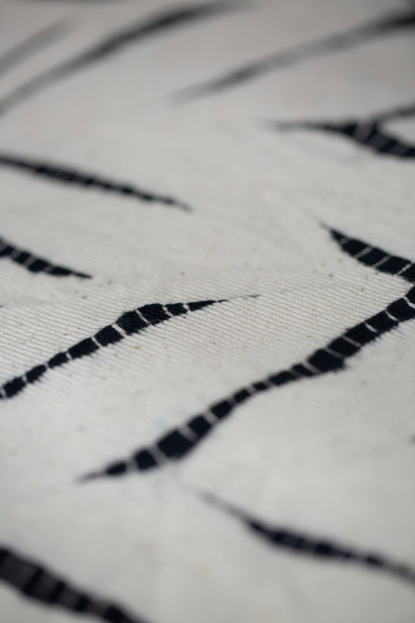 black / ivory organic cotton pouch S with shibori dyed pattern