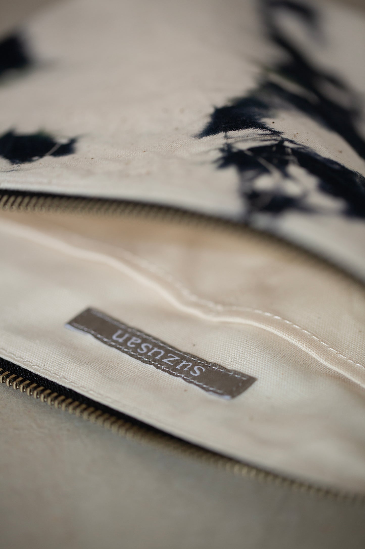 black / ivory organic cotton pouch M with shibori dyed pattern