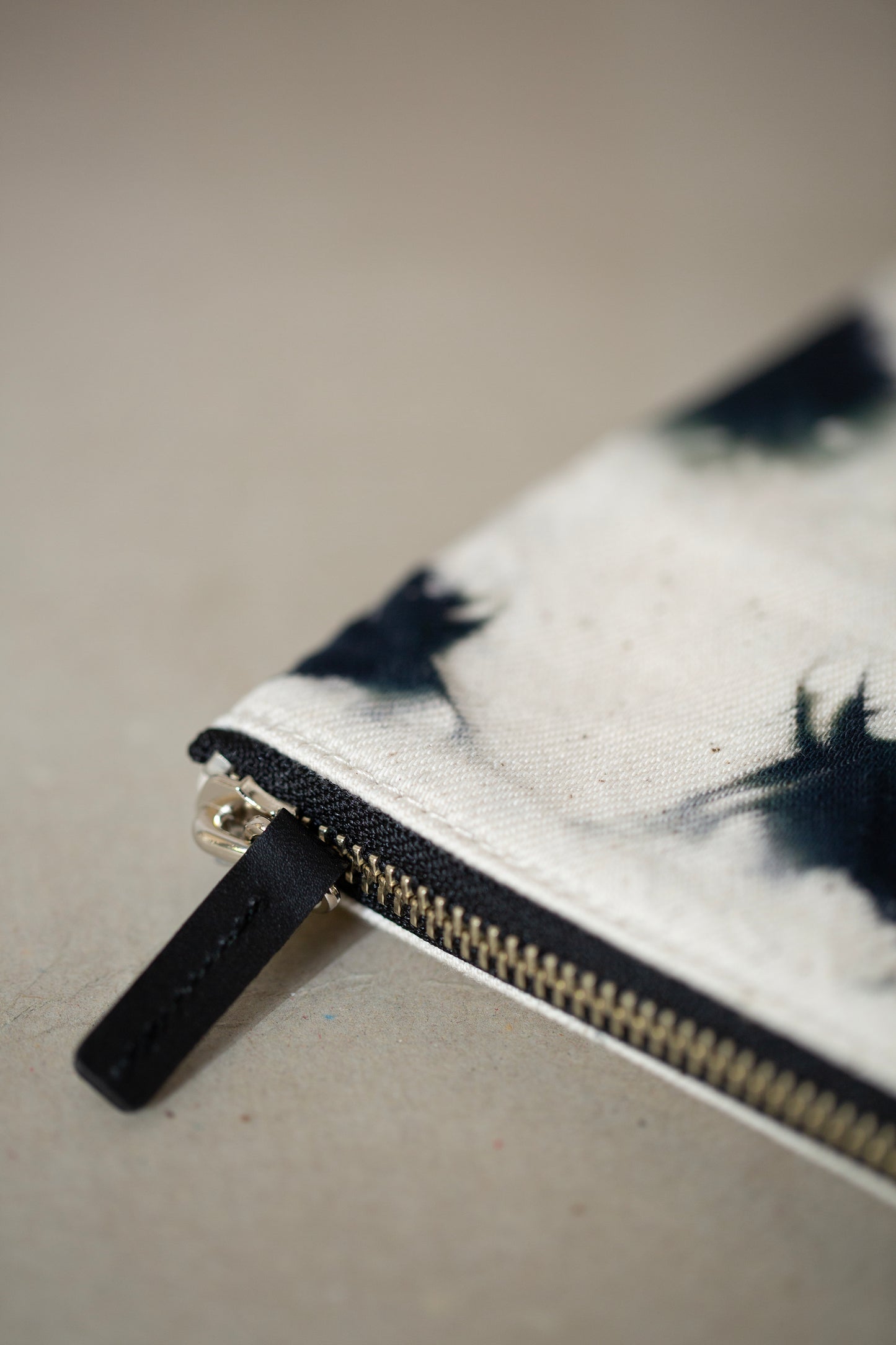black / ivory organic cotton pouch M with shibori dyed pattern