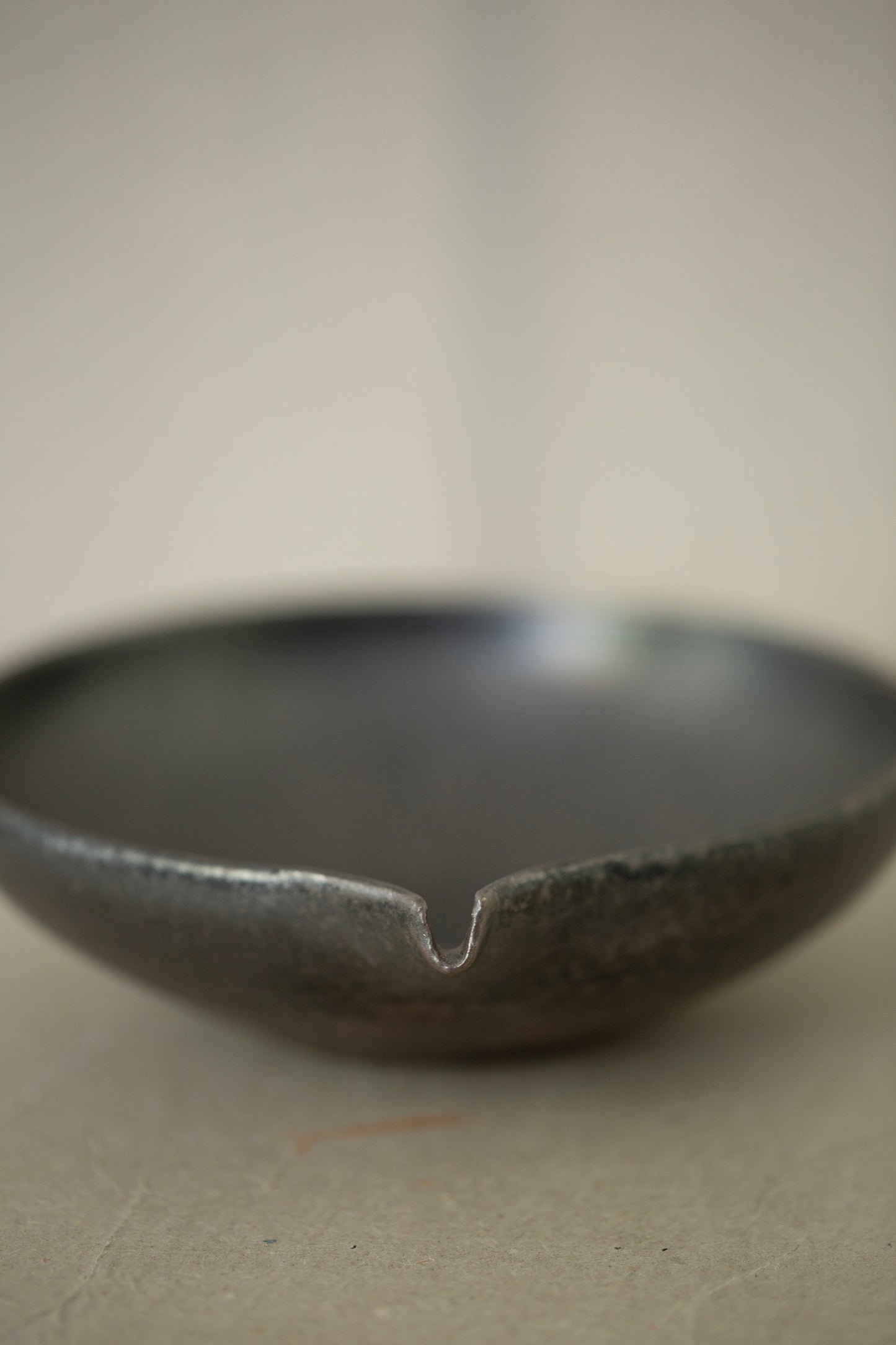 Ceramic sake pourer + saucer by Yohji Matsumiya