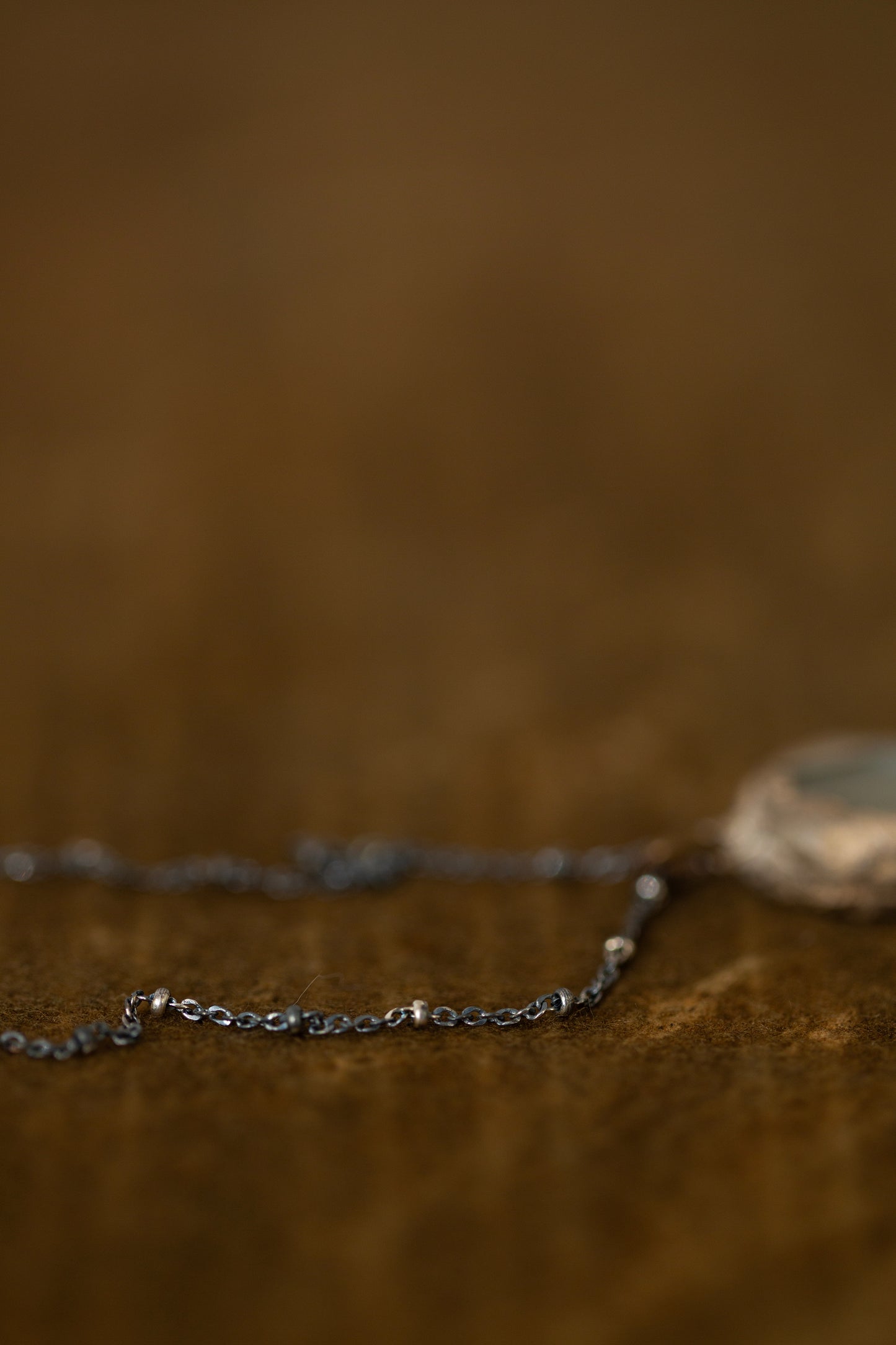 Necklace with silver framed glass