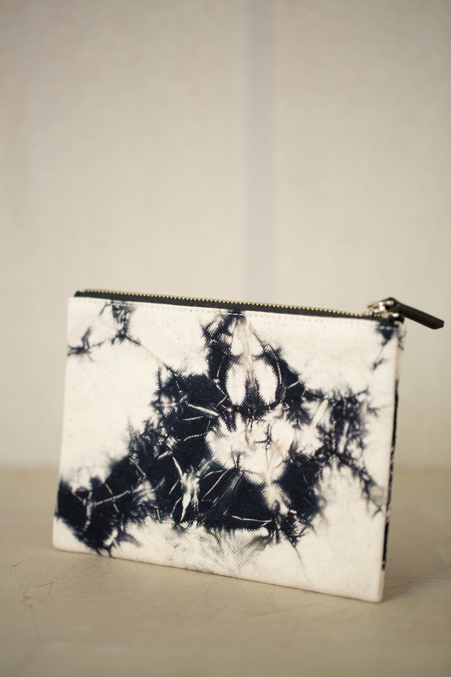black / ivory organic cotton pouch S with shibori dyed pattern