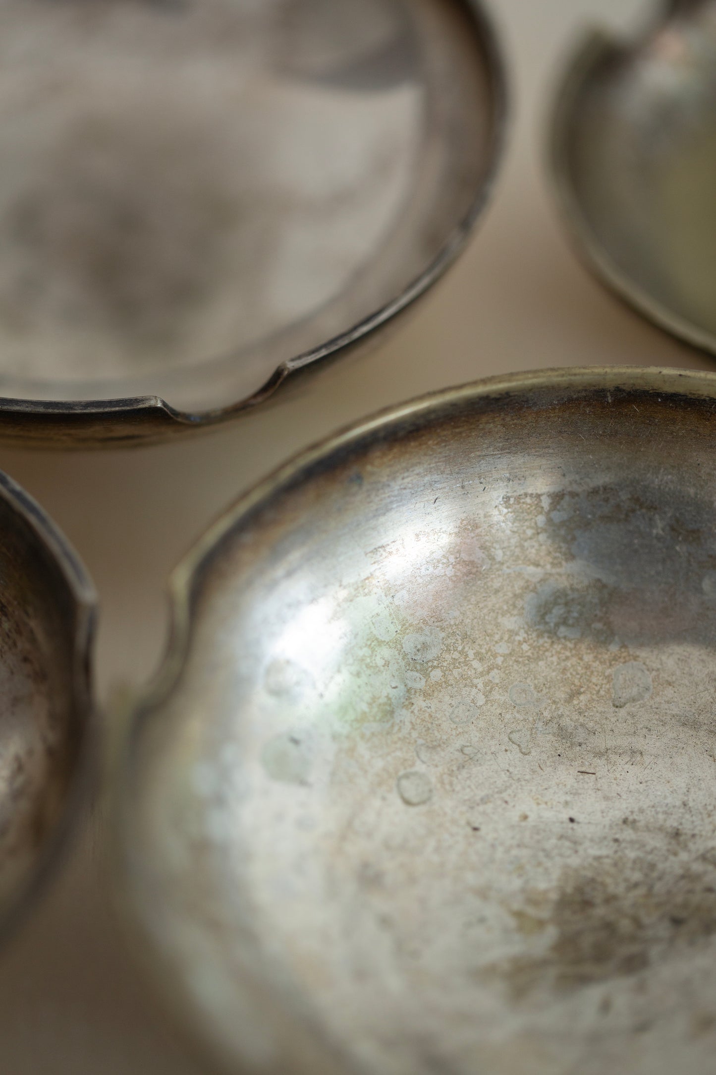 collection of metal ashtrays