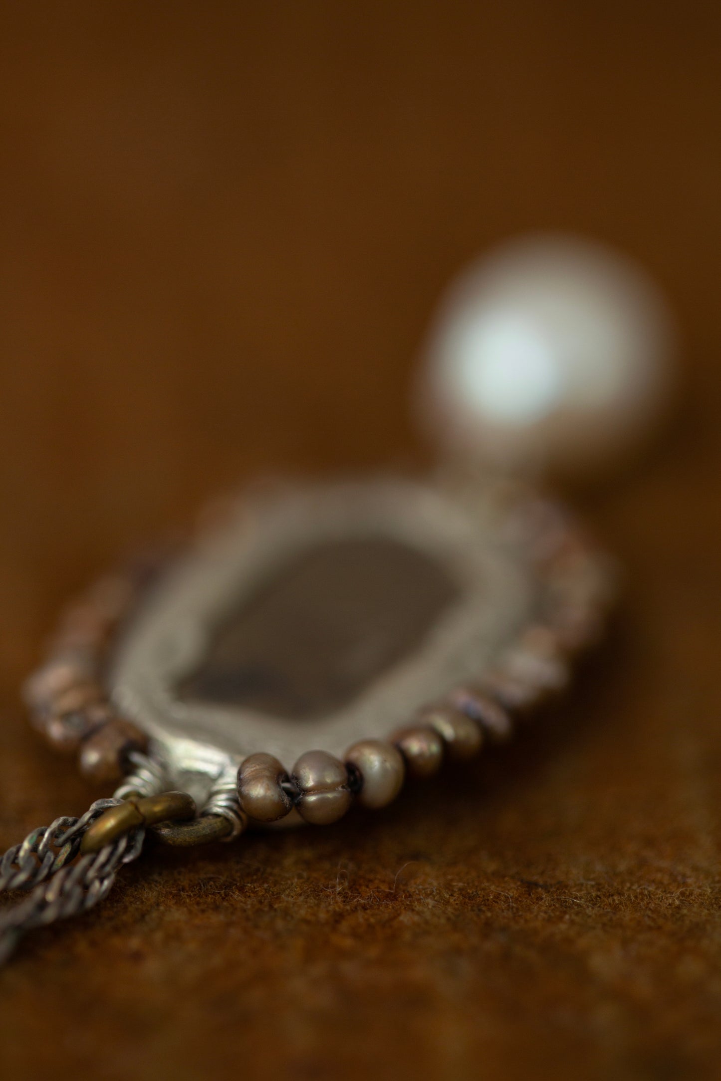 Necklace with antique opaque mirror and pearls