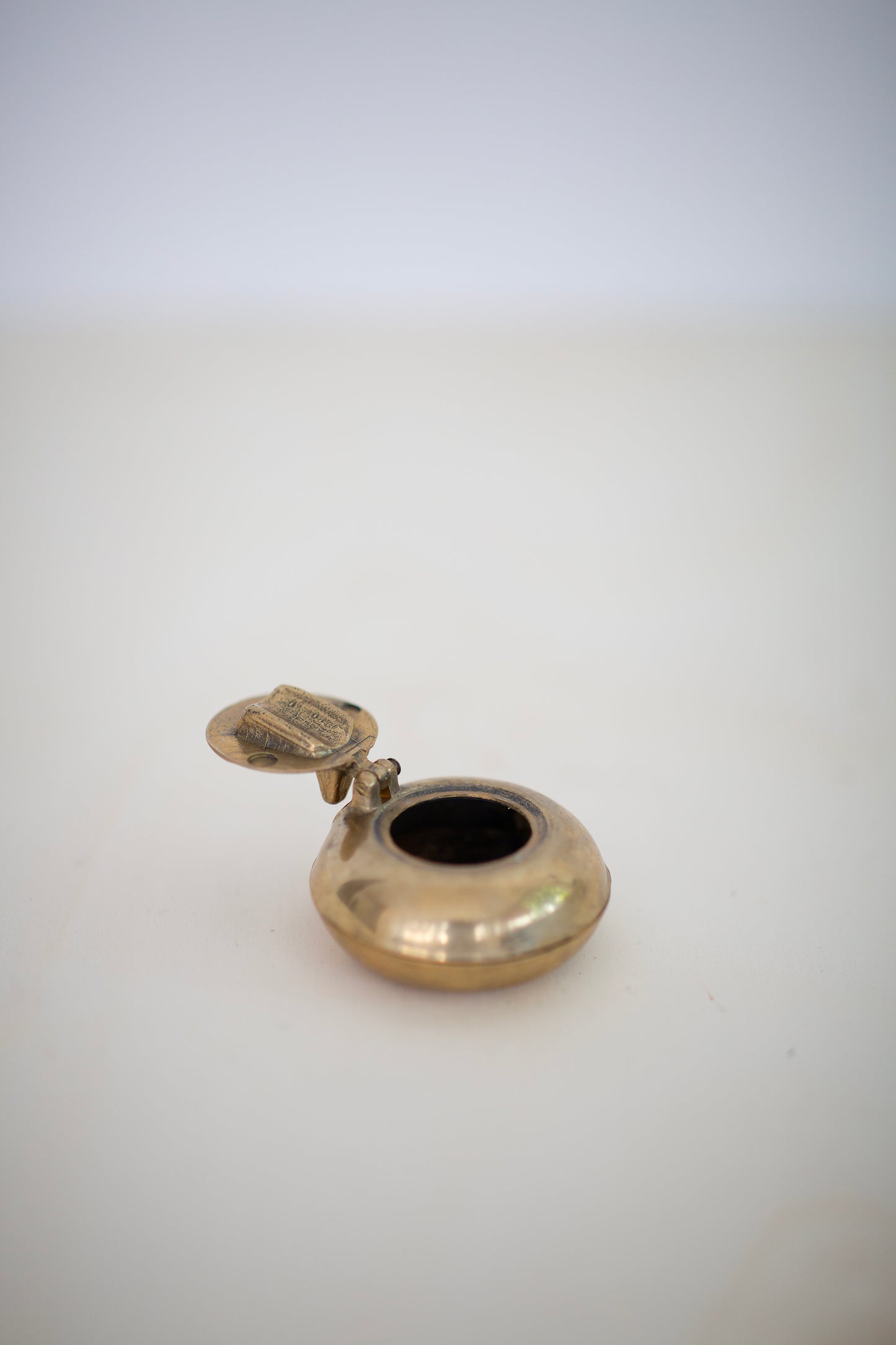 Portable brass ashtray