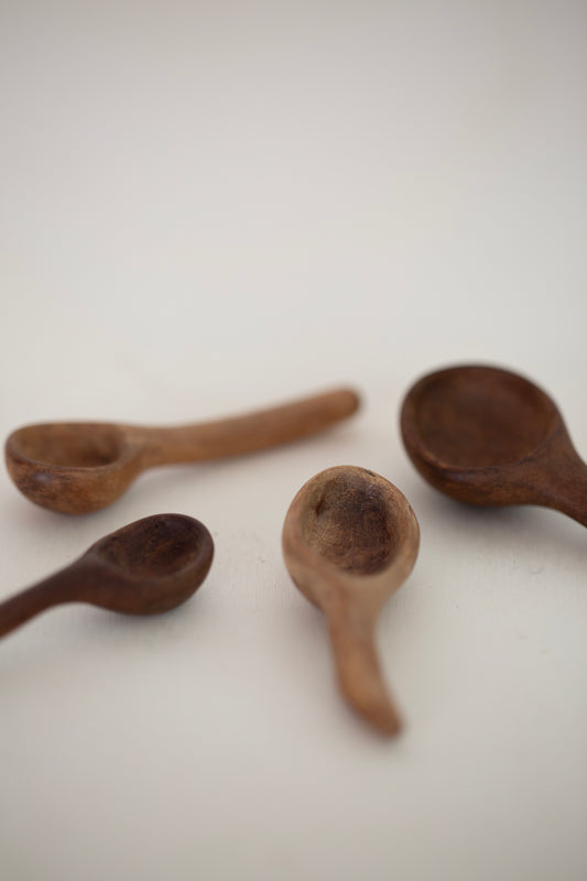 Set of little carved wooden spoons