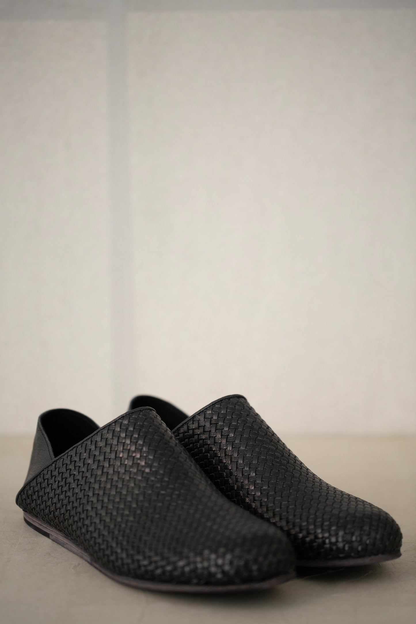 handmade woven cowhide babouche black