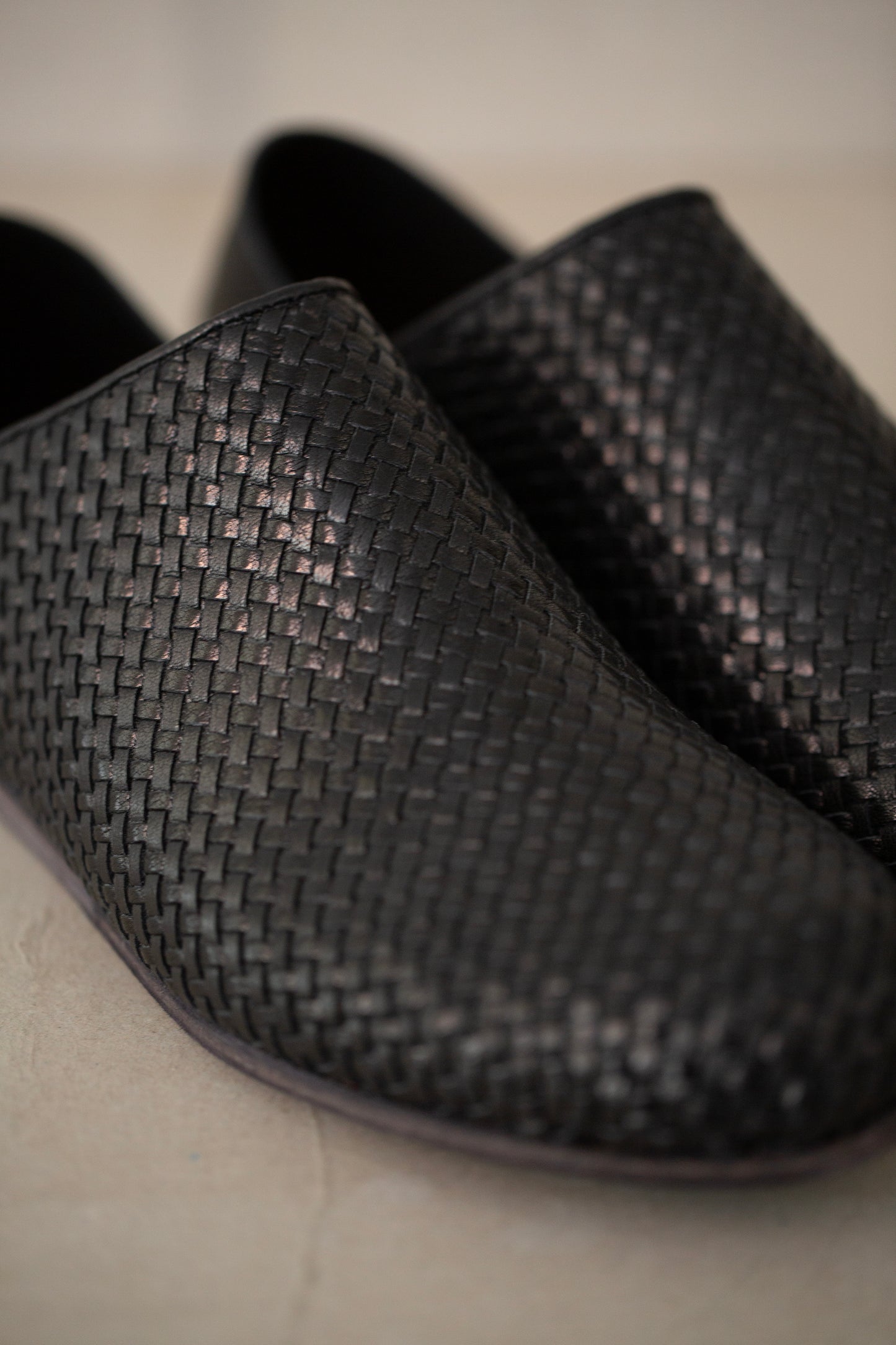 handmade woven cowhide babouche black