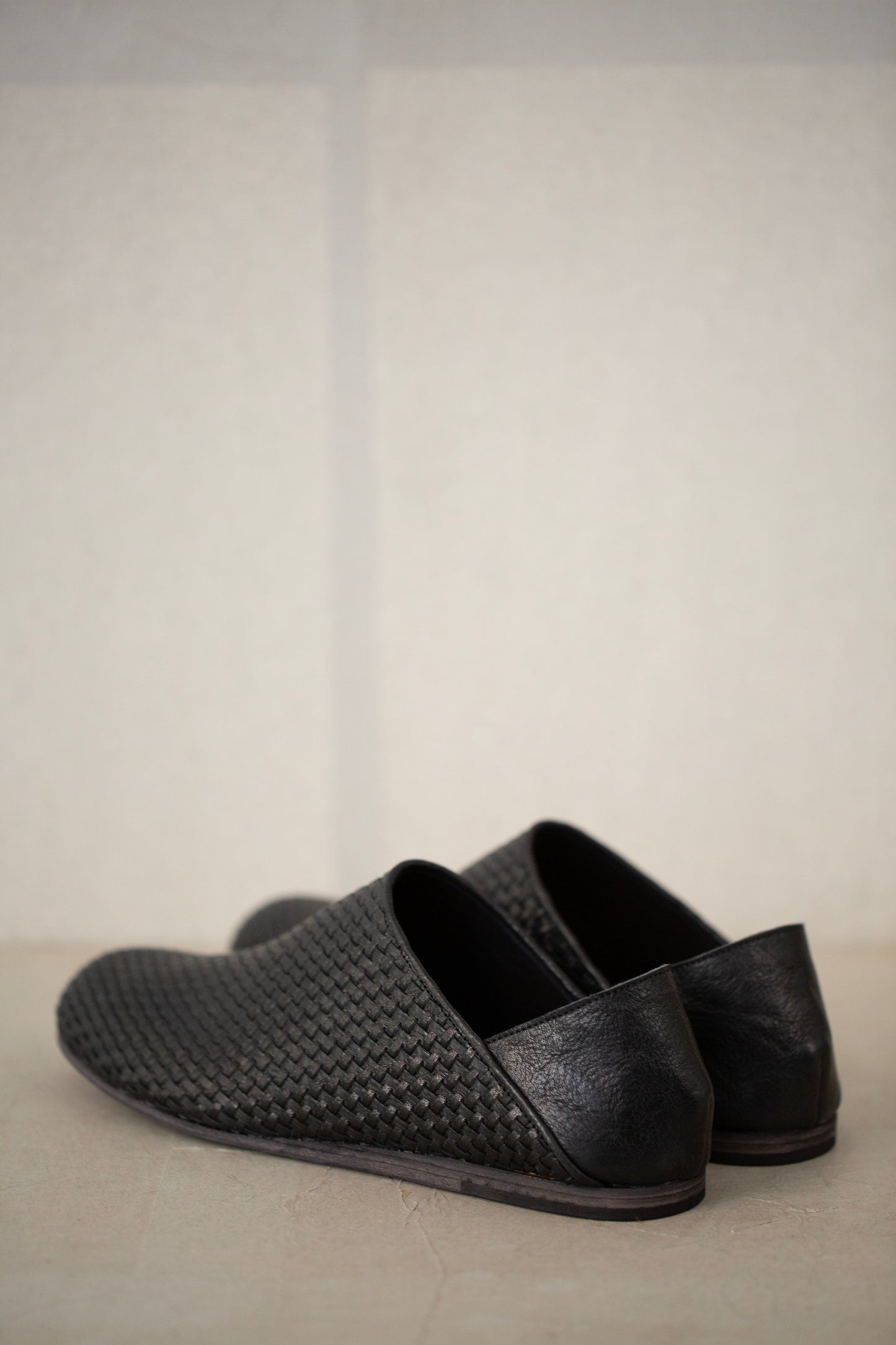 handmade woven cowhide babouche black