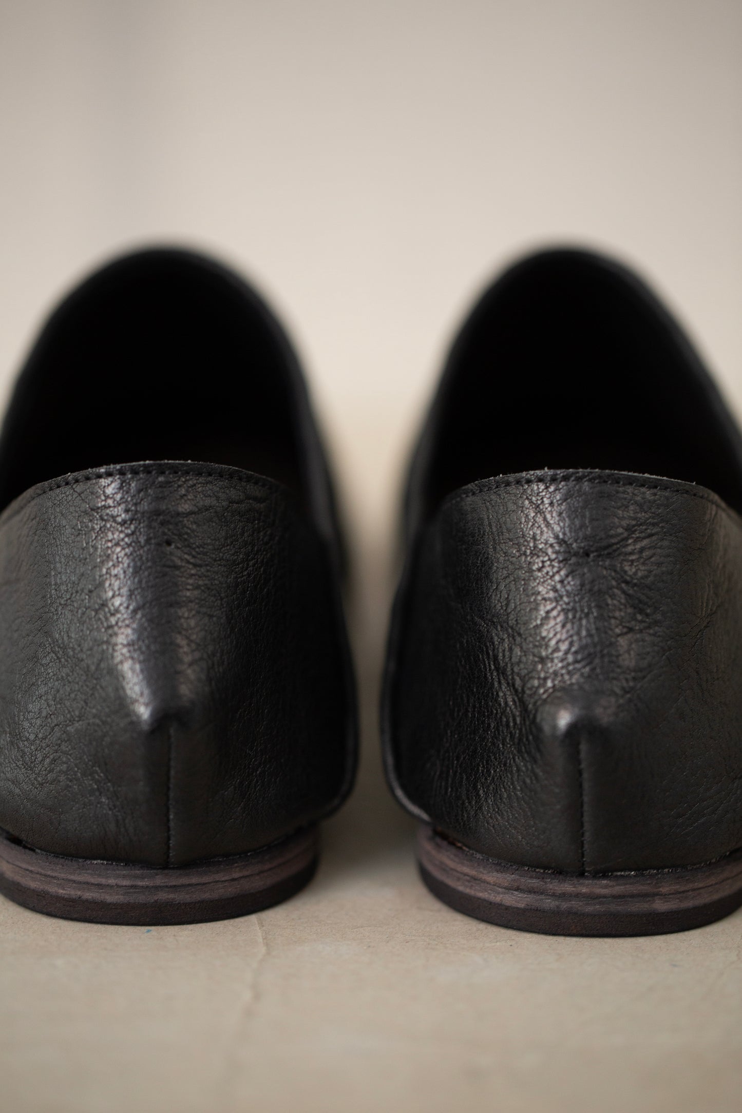 handmade woven cowhide babouche black