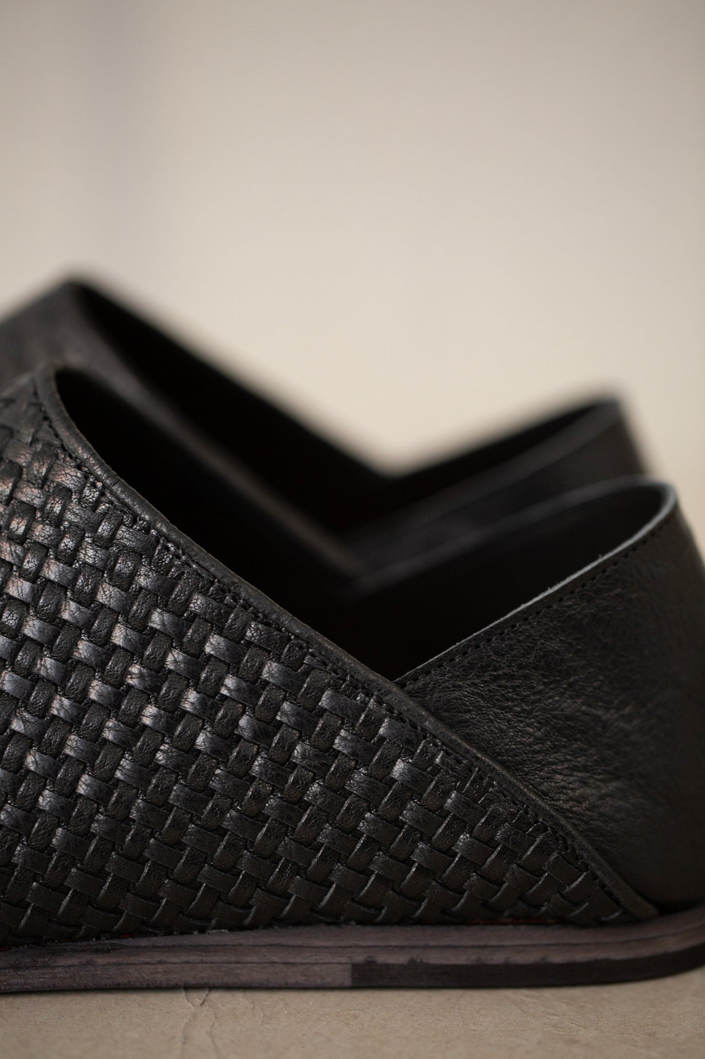 handmade woven cowhide babouche black