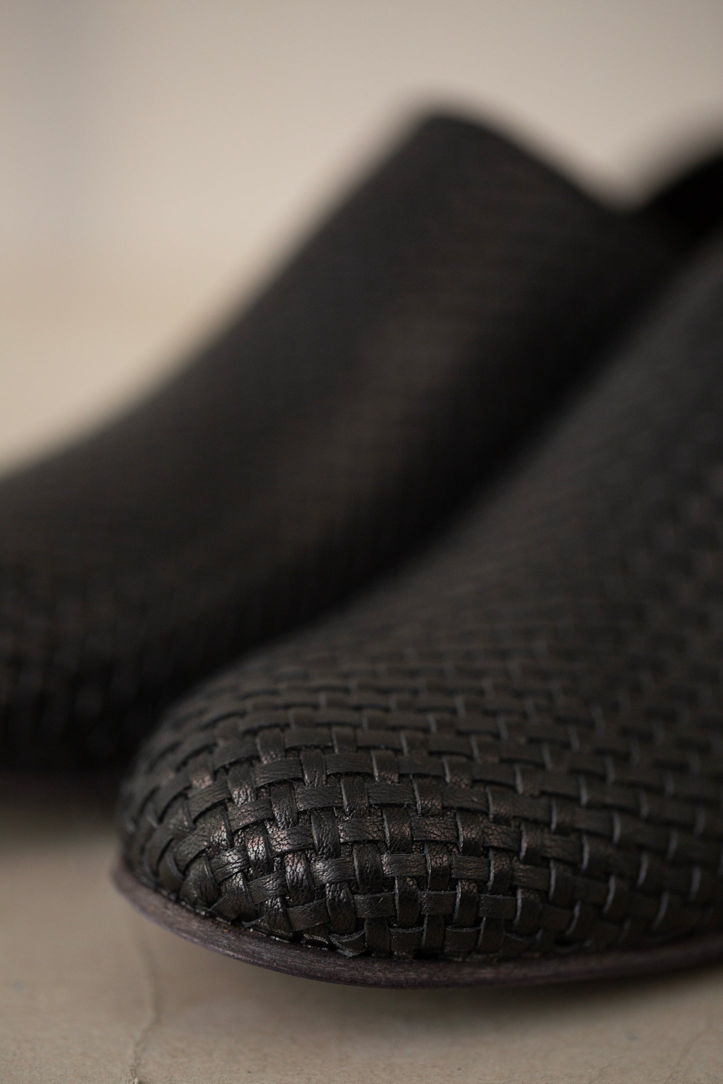 handmade woven cowhide babouche black