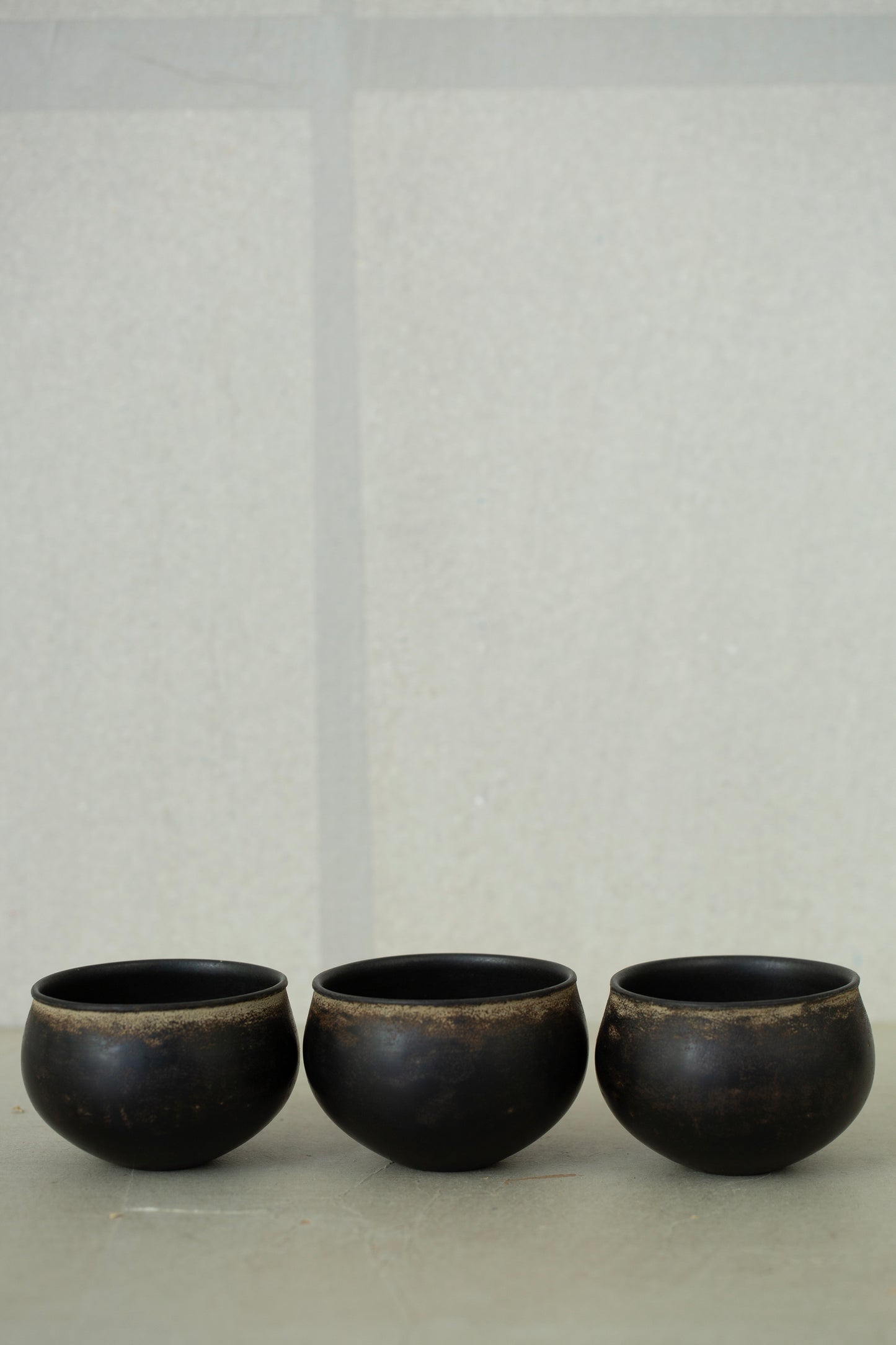 Small ceramic cups by Kenta Anzai