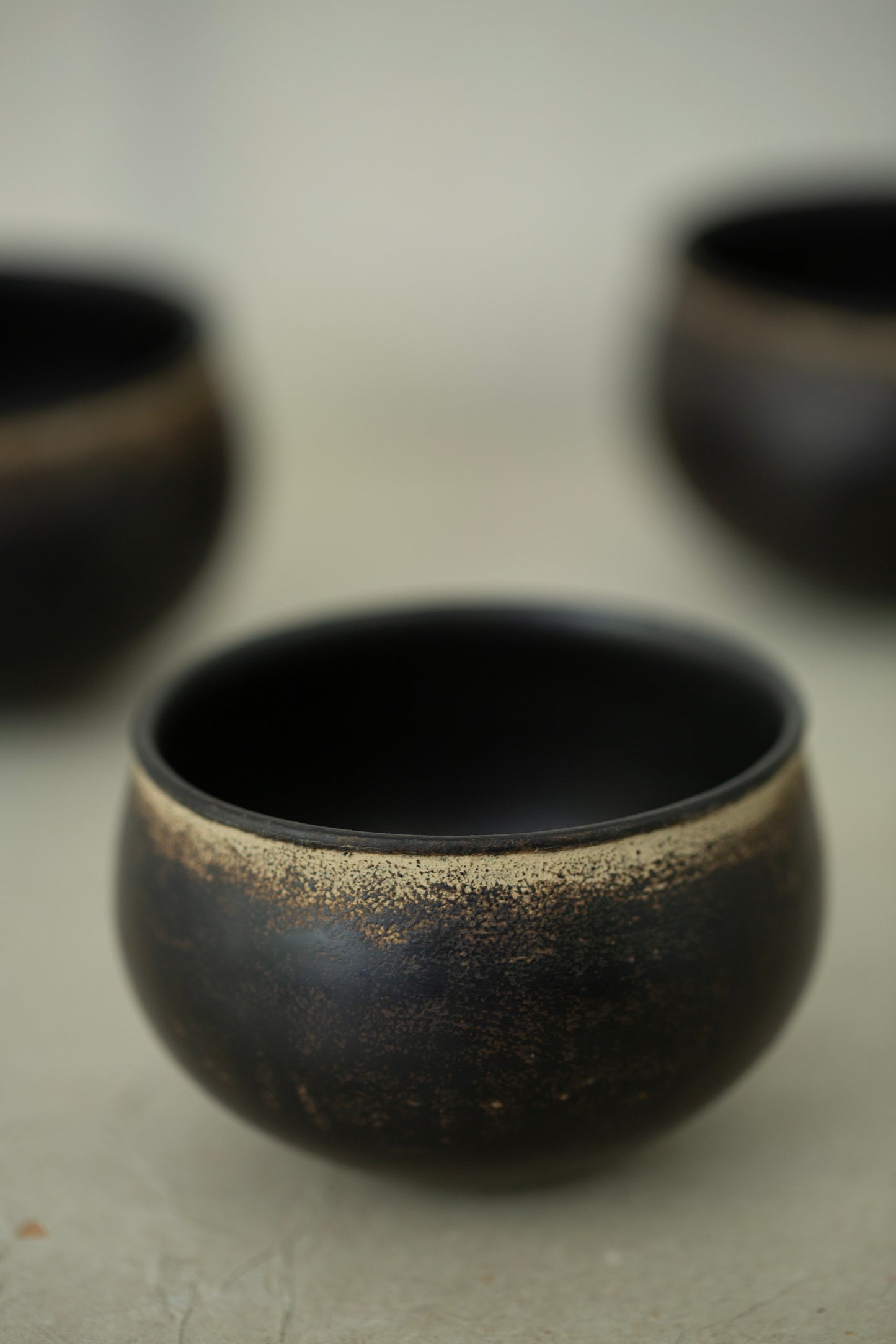 Small ceramic cups by Kenta Anzai