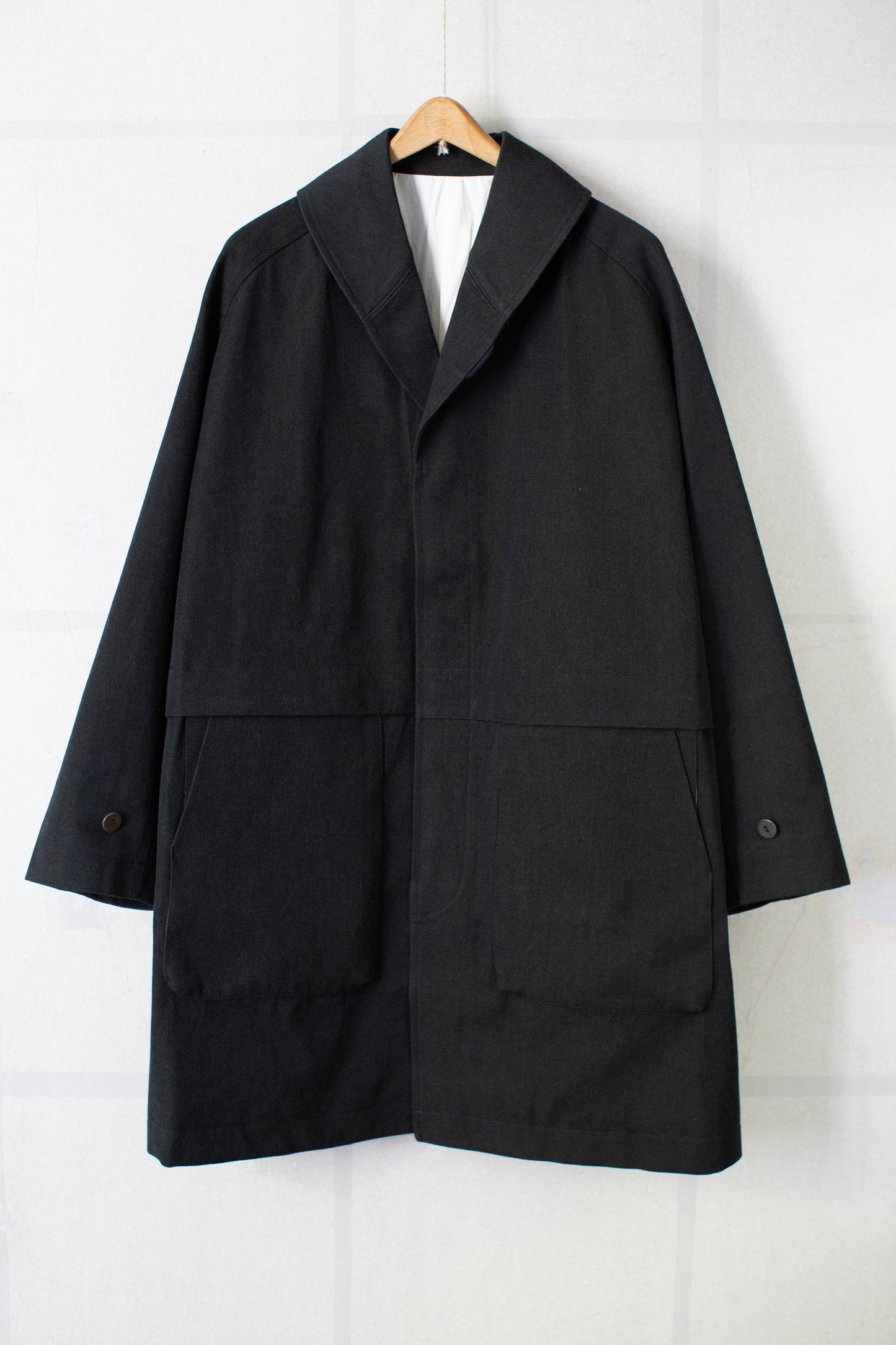 Overcoat in black/green wool-cotton twill