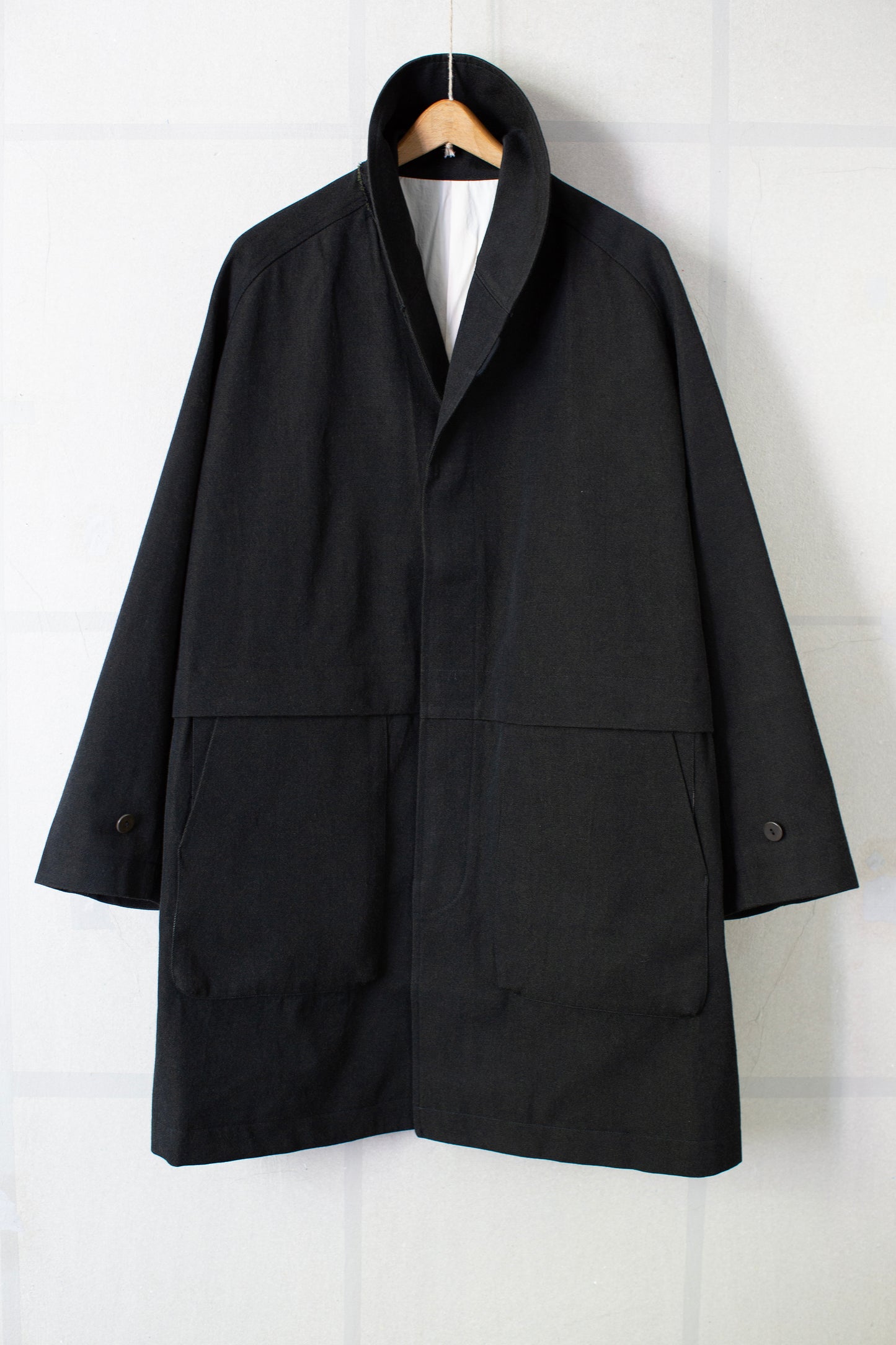 Overcoat in black/green wool-cotton twill