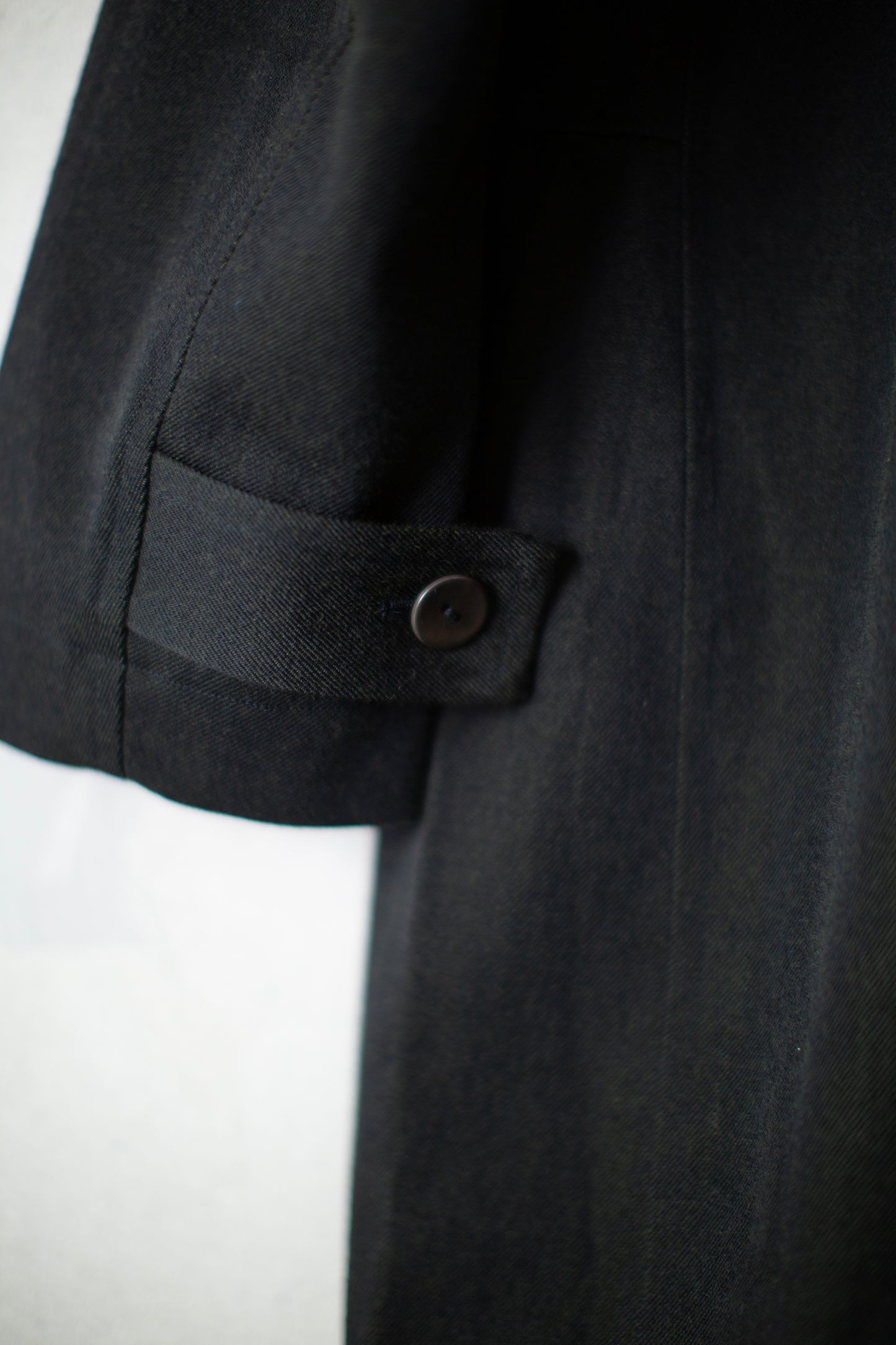 Overcoat in black/green wool-cotton twill