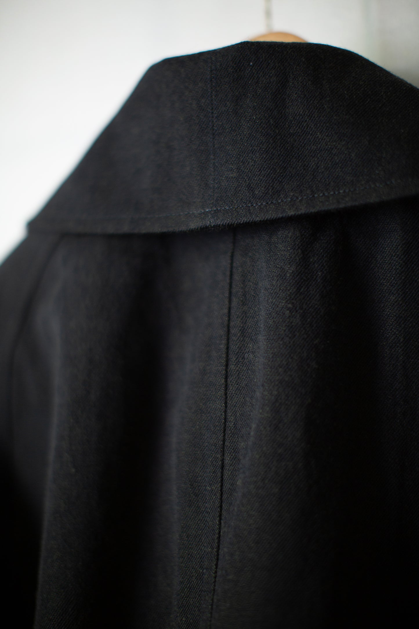 Overcoat in black/green wool-cotton twill