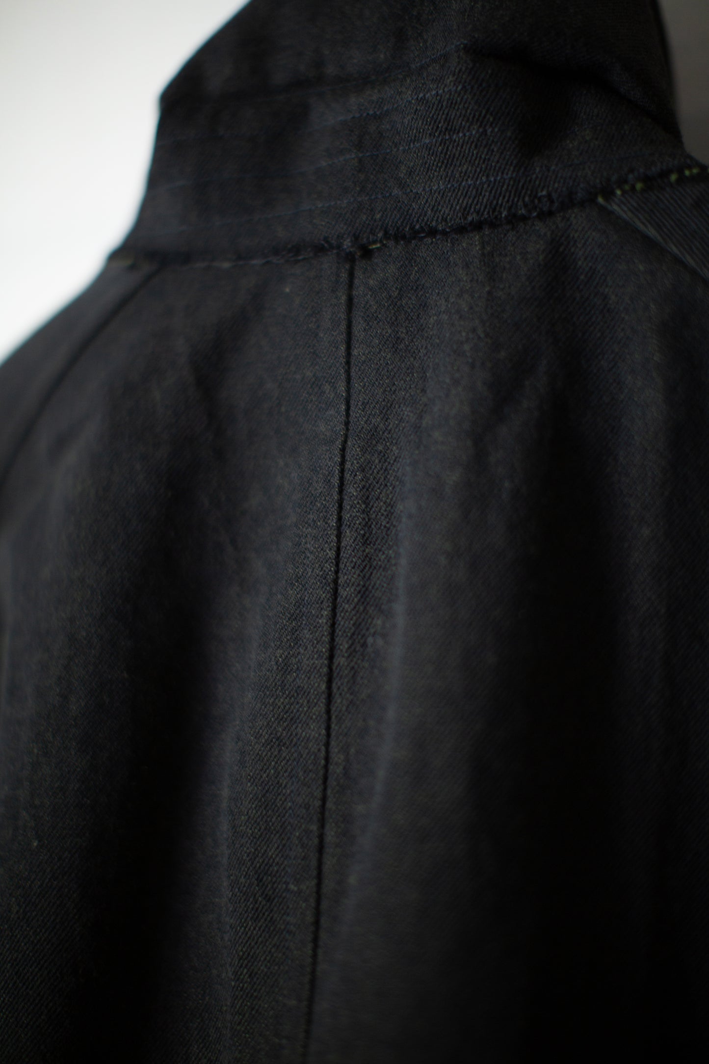 Overcoat in black/green wool-cotton twill