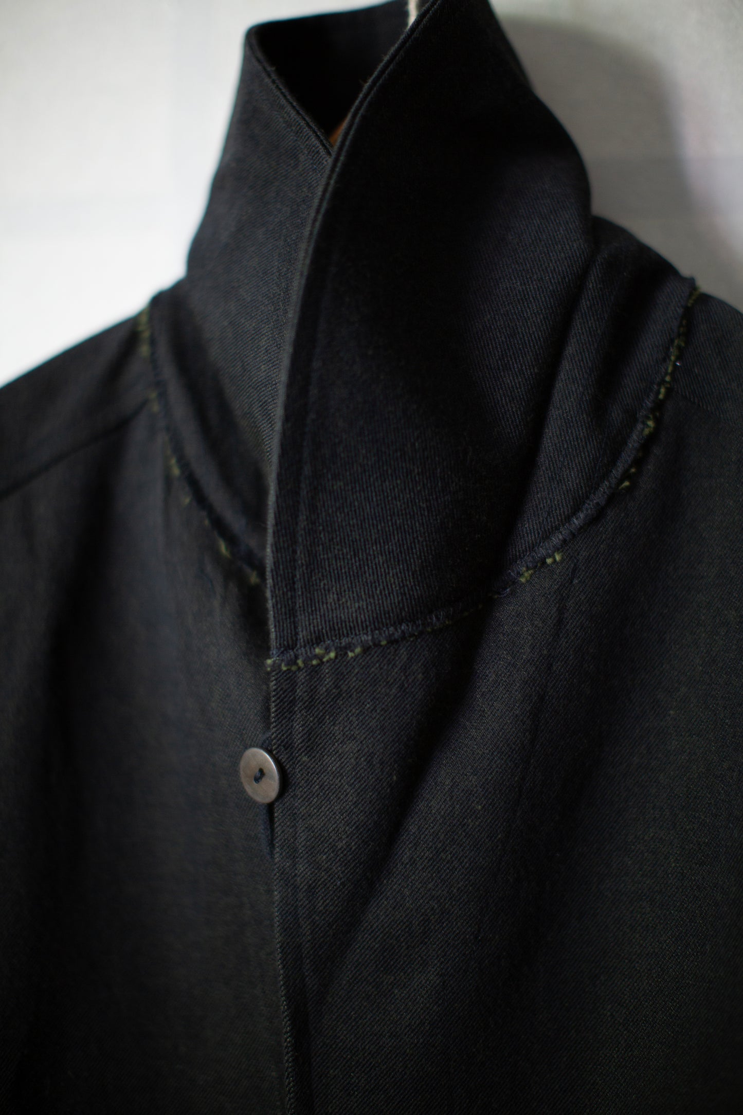 Overcoat in black/green wool-cotton twill