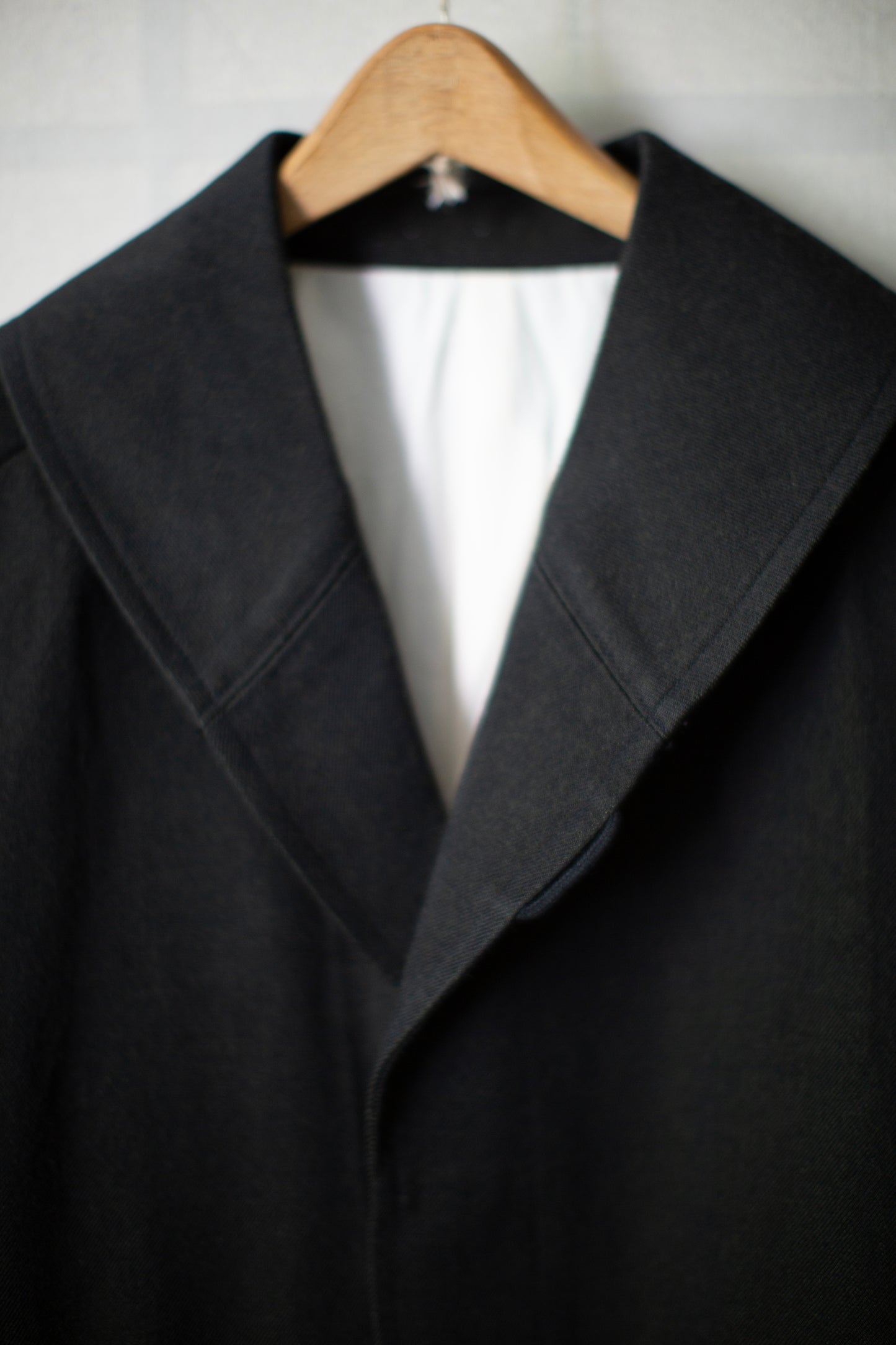 Overcoat in black/green wool-cotton twill