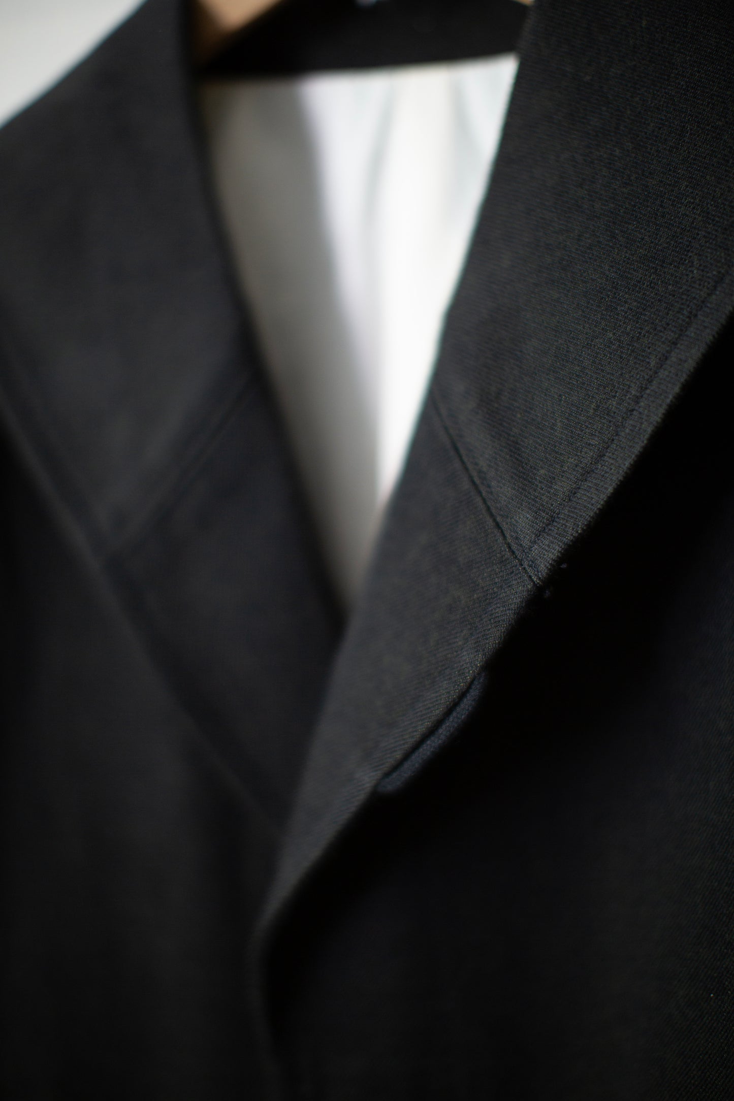 Overcoat in black/green wool-cotton twill