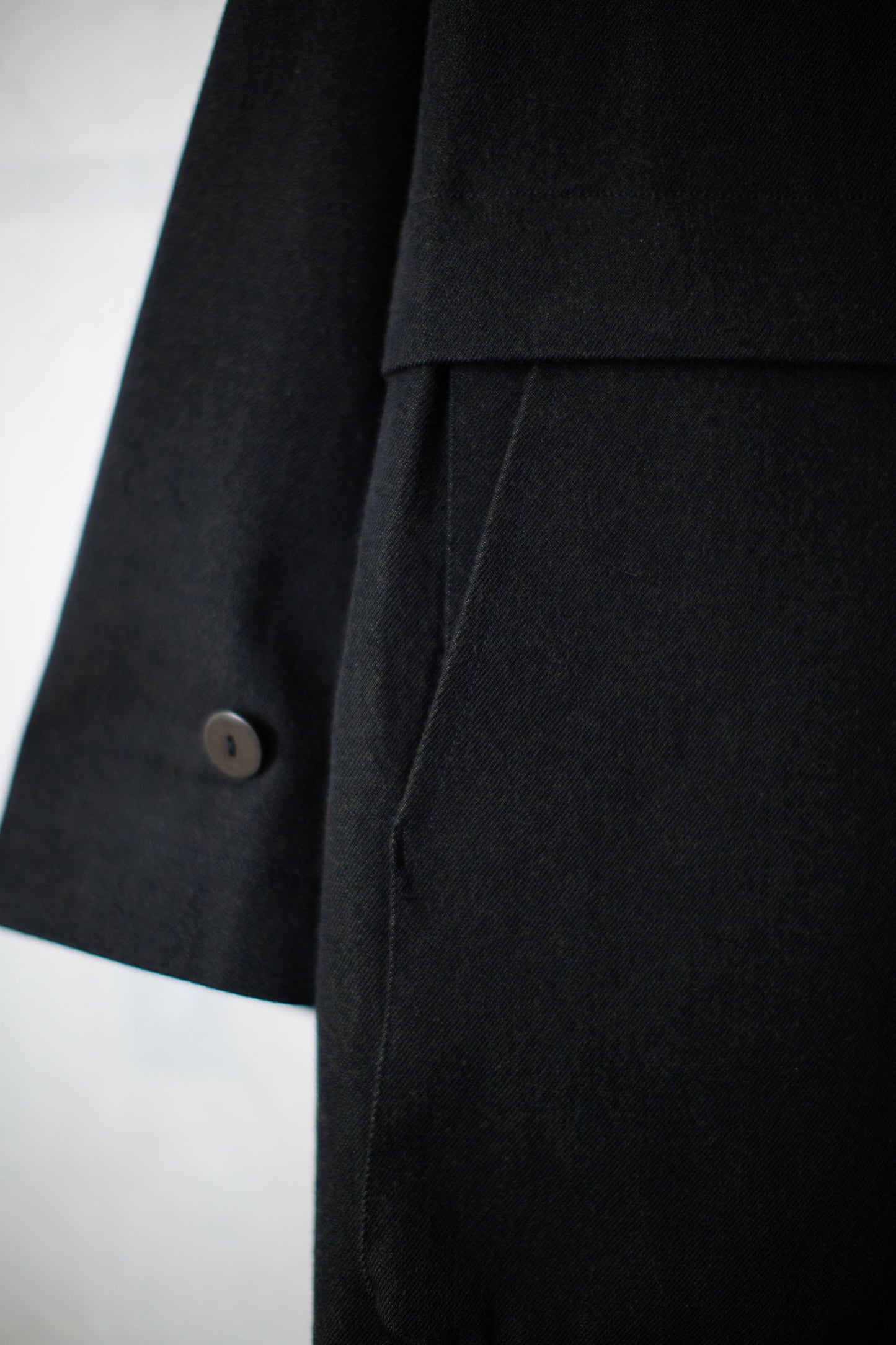 Overcoat in black/green wool-cotton twill