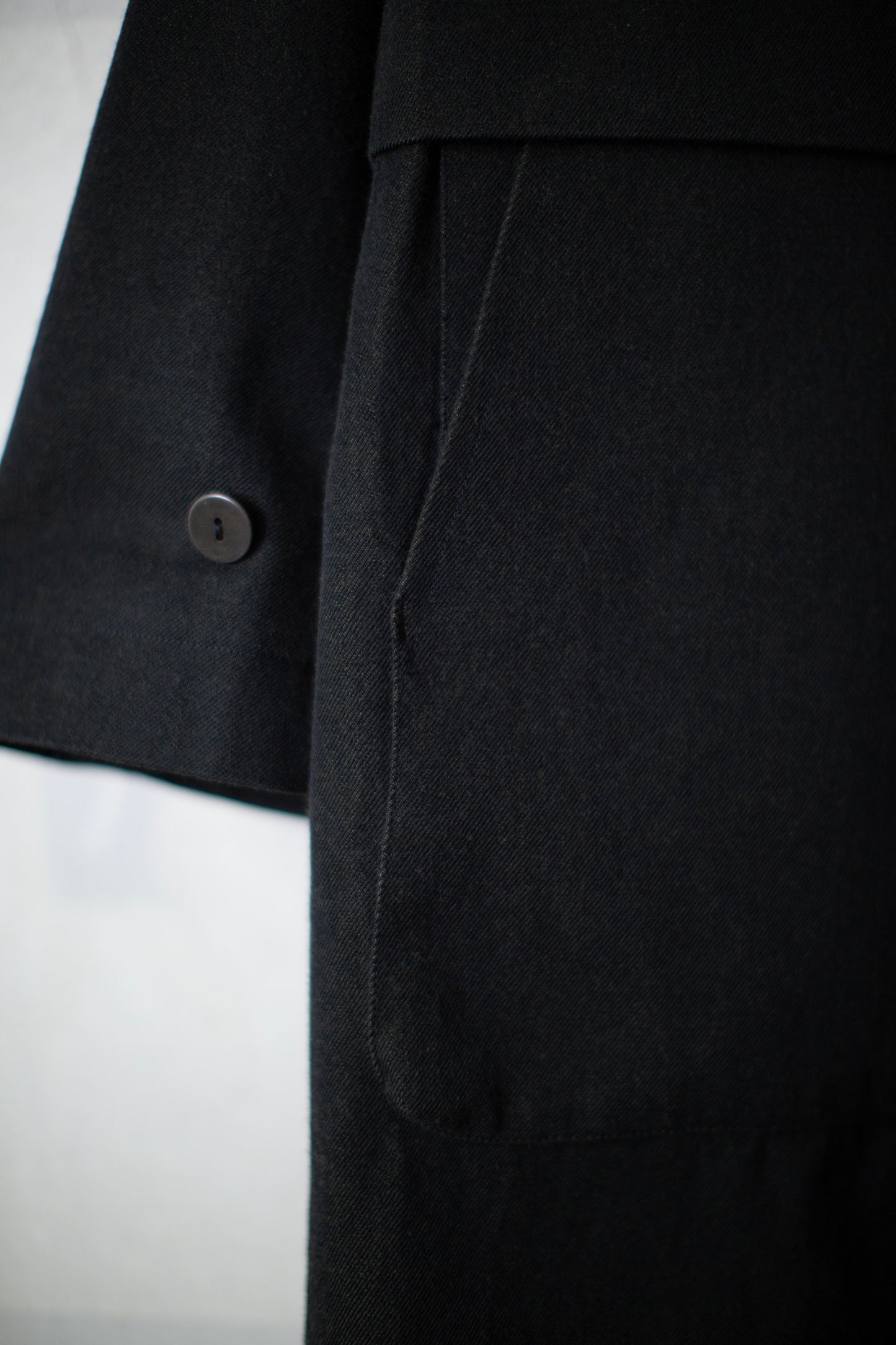 Overcoat in black/green wool-cotton twill