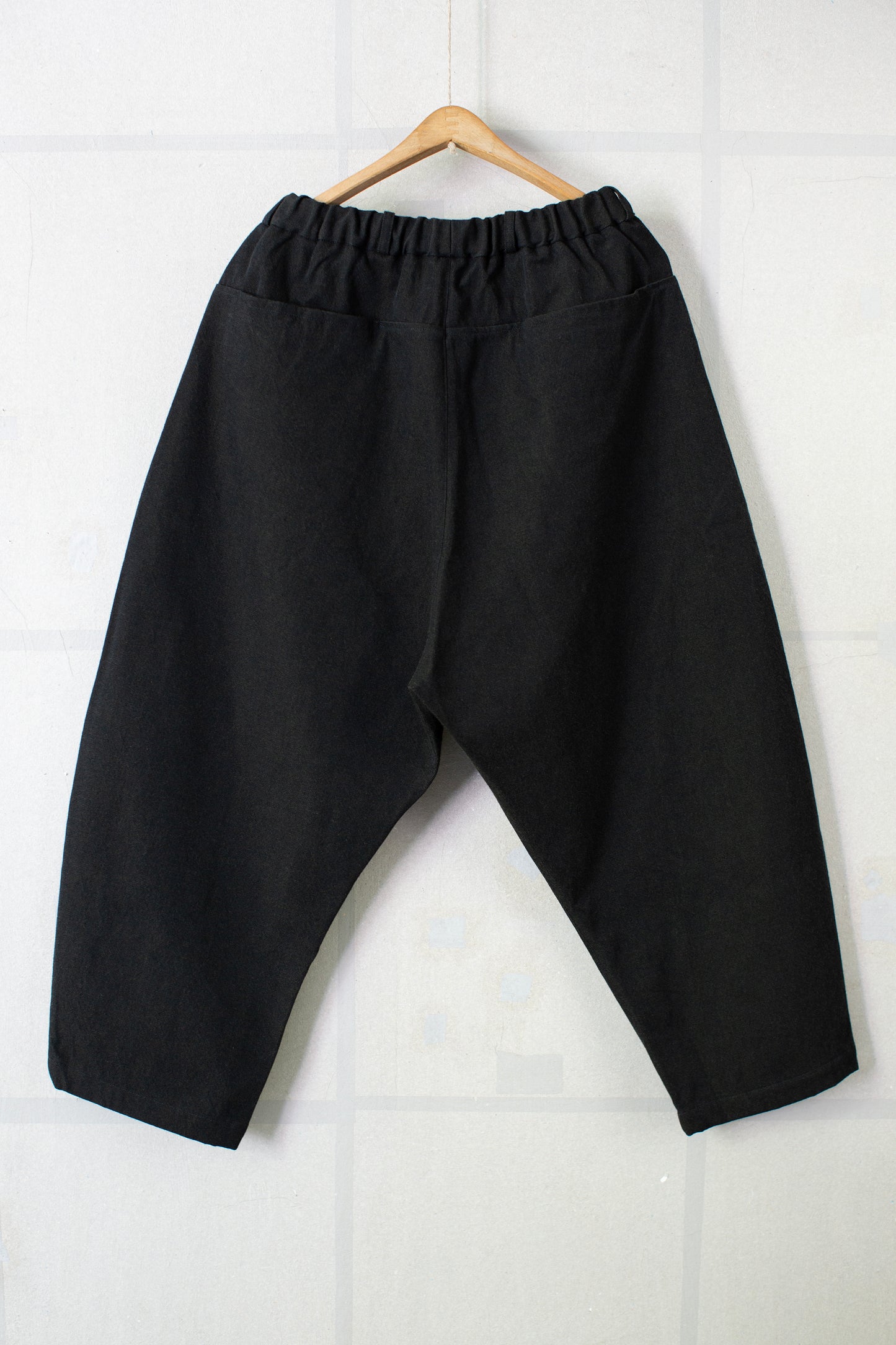 tapered pants in black/green wool-cotton twill