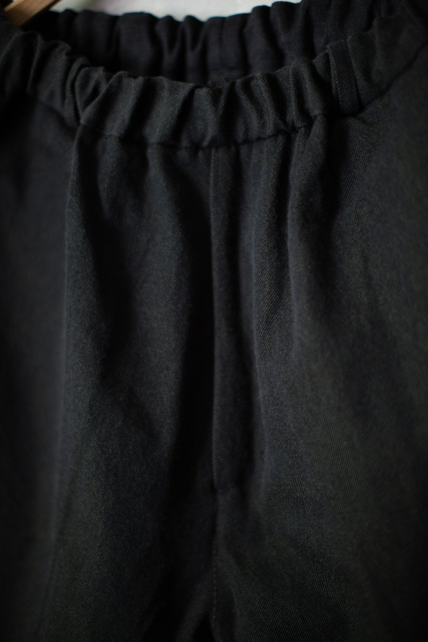 tapered pants in black/green wool-cotton twill