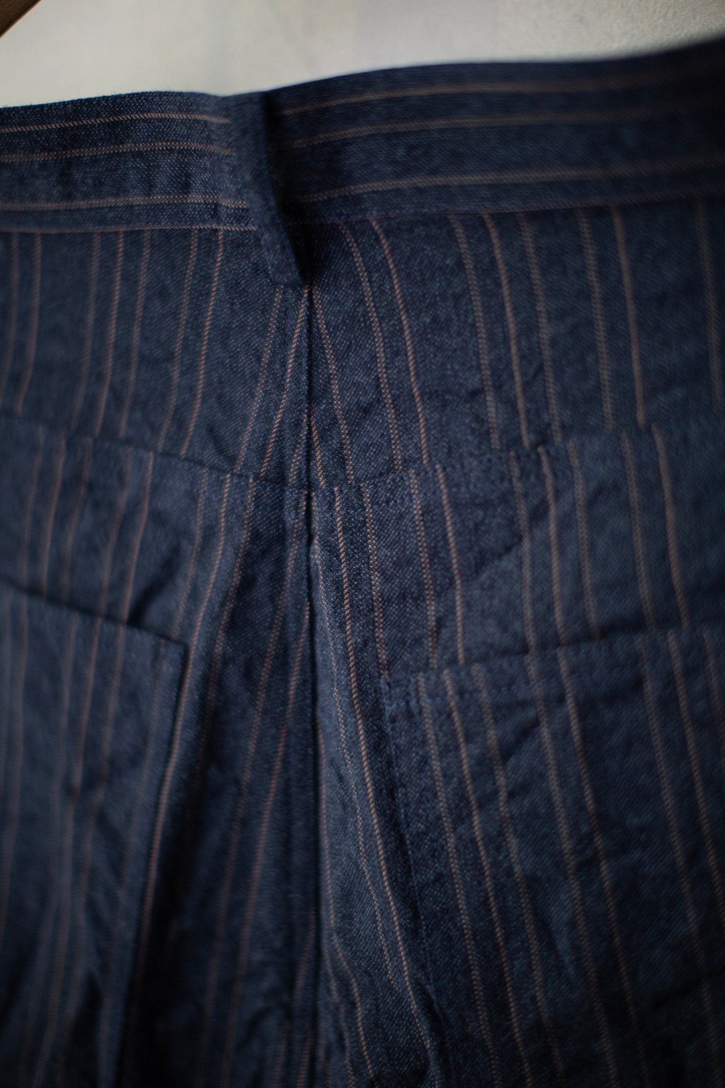 Indigo stripe skewed baggy 5 pocket pants