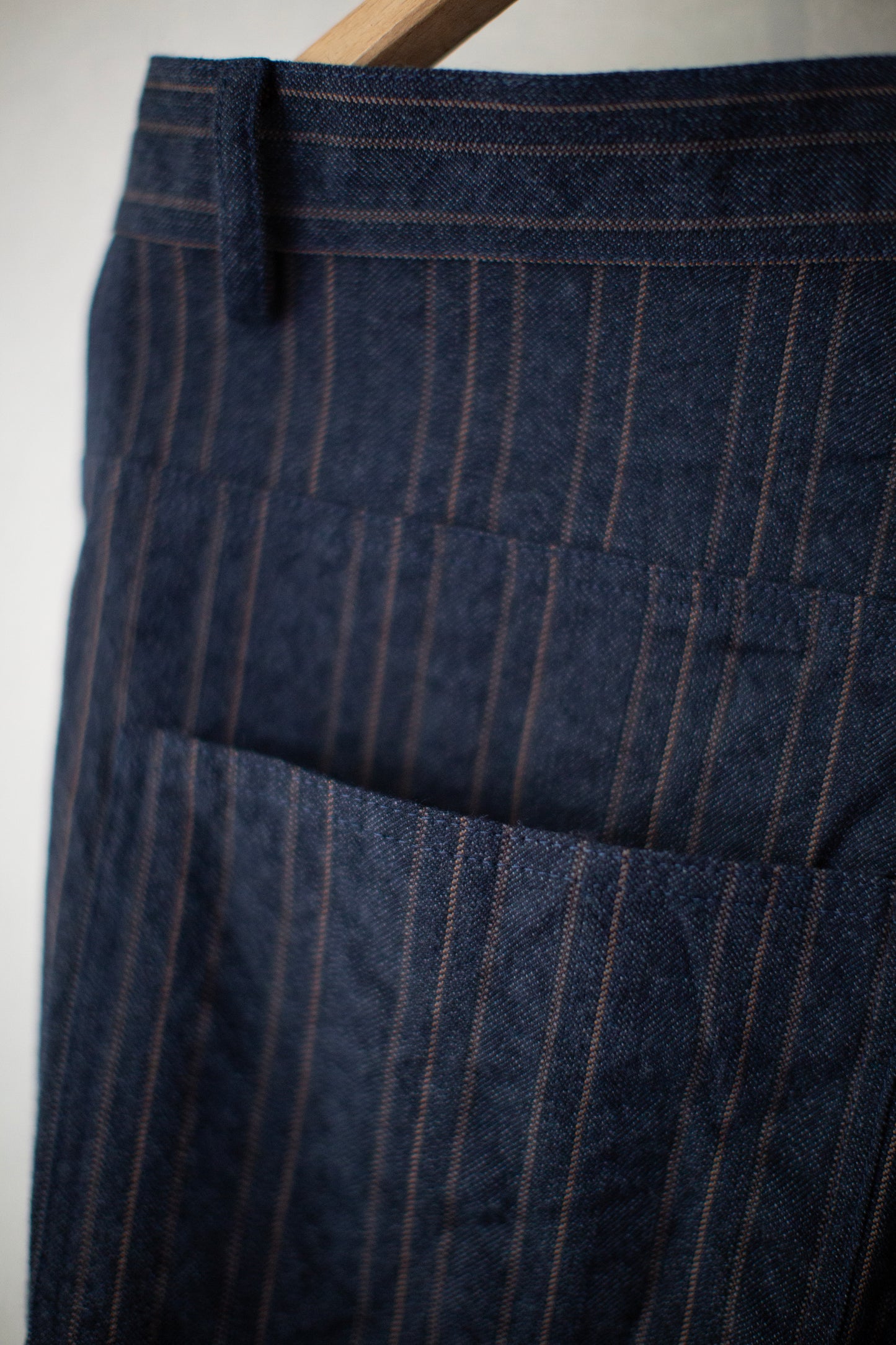Indigo stripe skewed baggy 5 pocket pants
