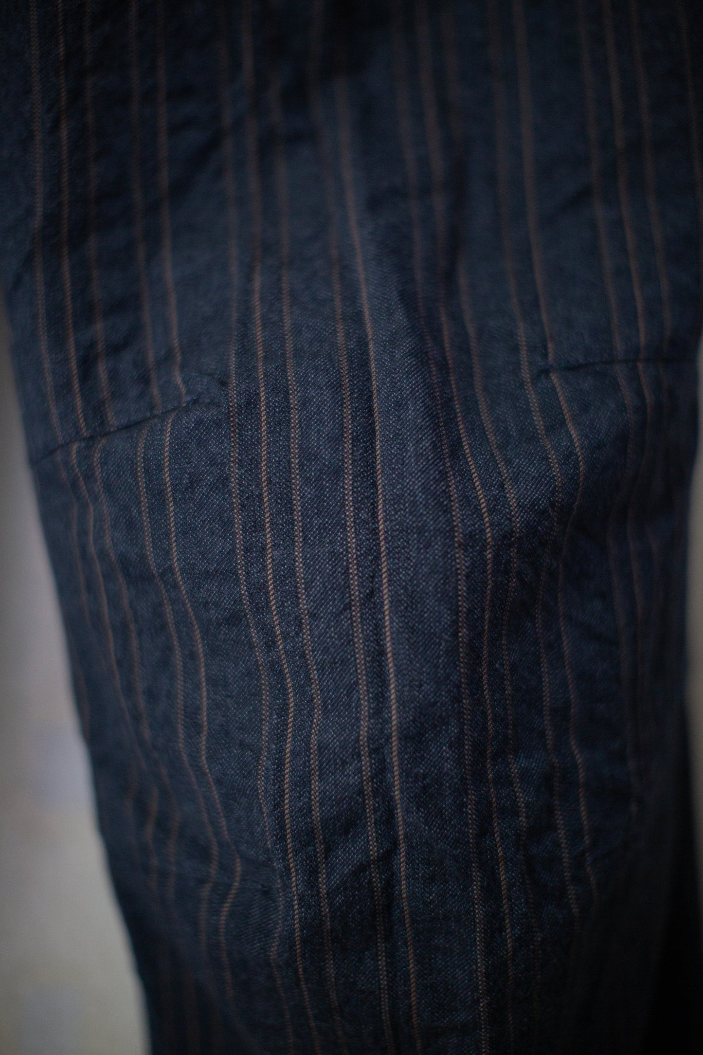 Indigo stripe skewed baggy 5 pocket pants
