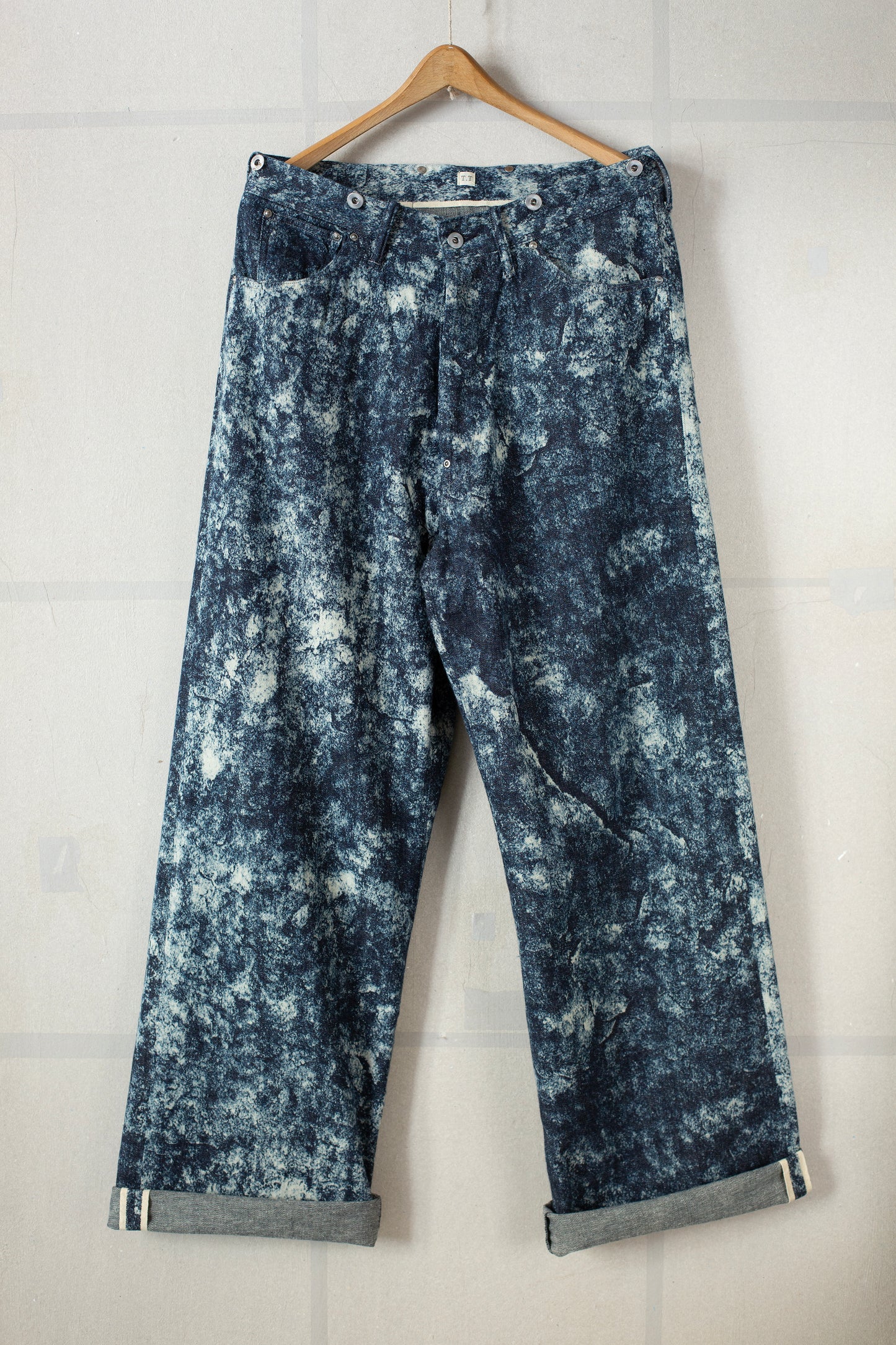 Discharged indigo denim trousers