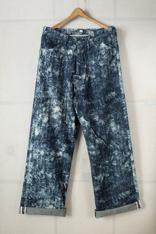 Discharged indigo denim trousers