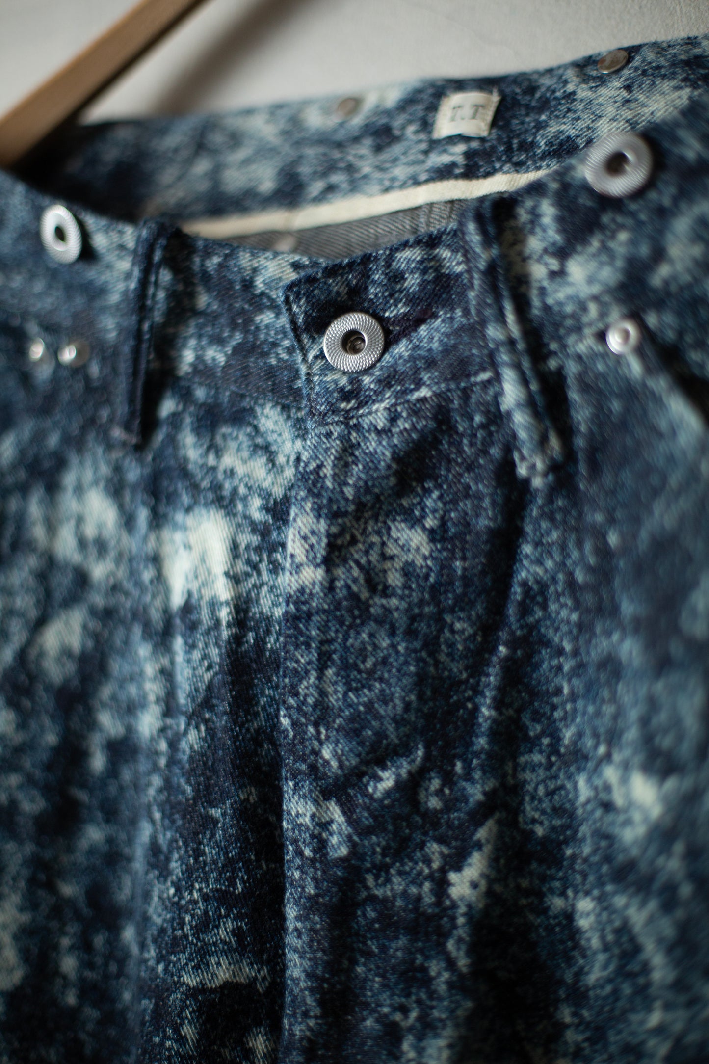 Discharged indigo denim trousers