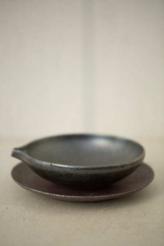 Ceramic sake pourer + saucer by Yohji Matsumiya